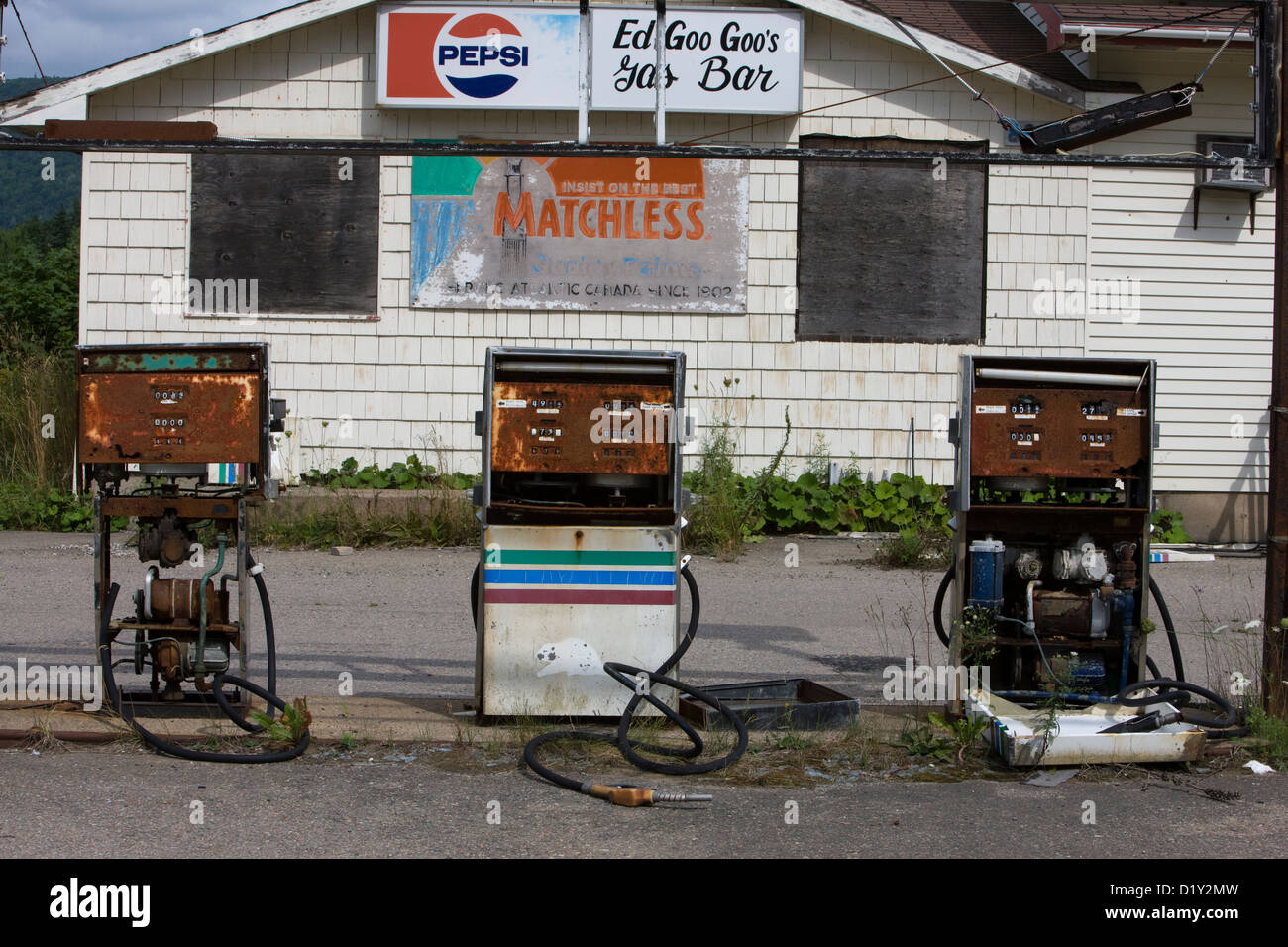 Ed Goo Goo's Gas Bar derelict petrol station with rusty petrol pumps in