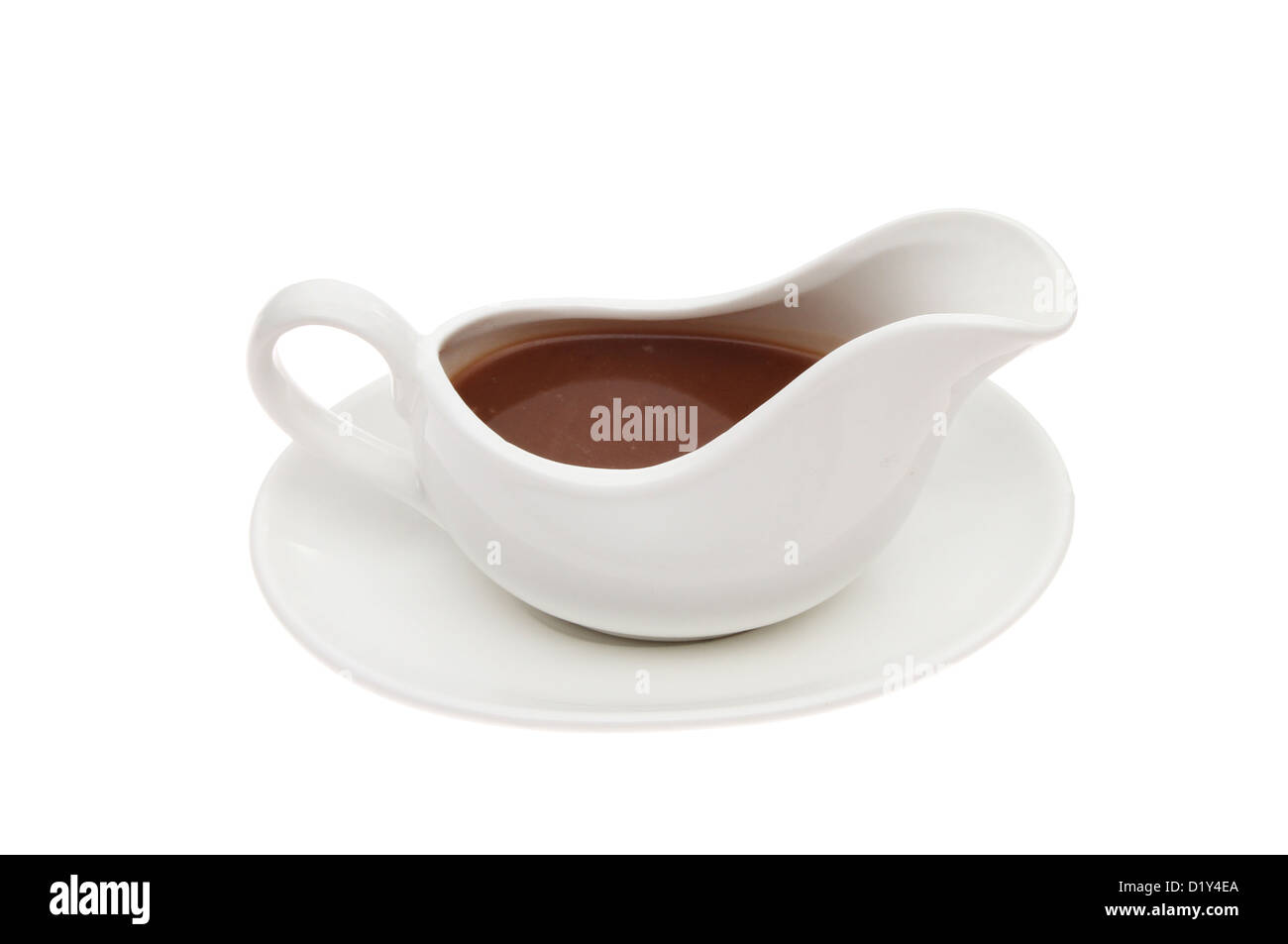 Gravy in a gravy boat isolated against white Stock Photo