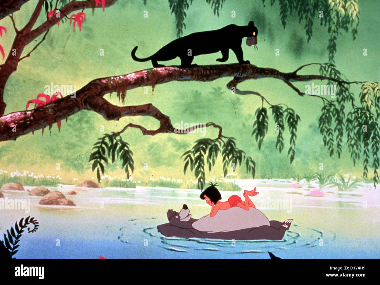 Das Dschungelbuch  Jungle Book,  Mowgli spielt mit Baloo und auf dem Ast lauert der schwarze Panther Baghira *** Local Caption Stock Photo