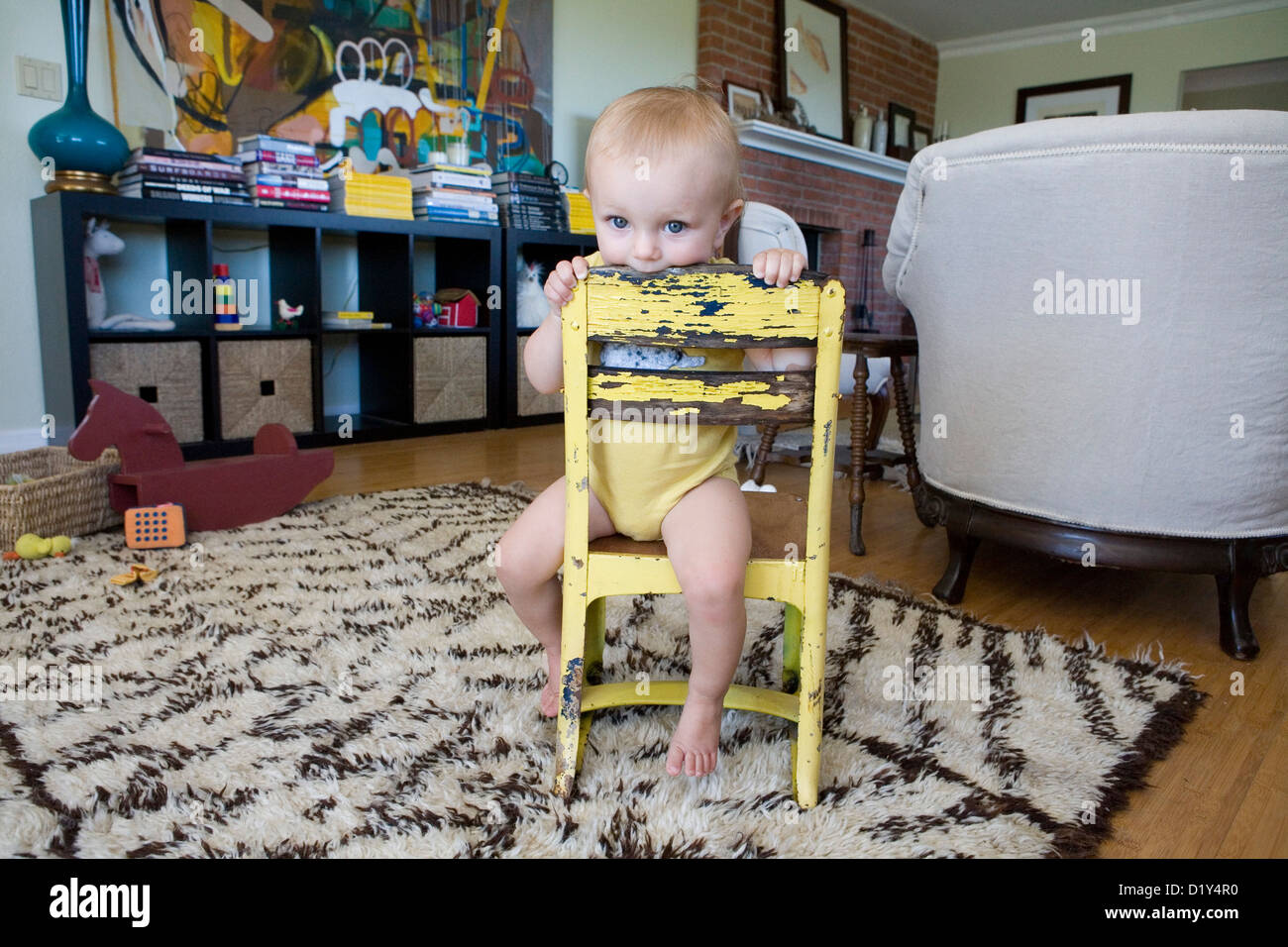 Baby on a little chair Stock Photo - Alamy