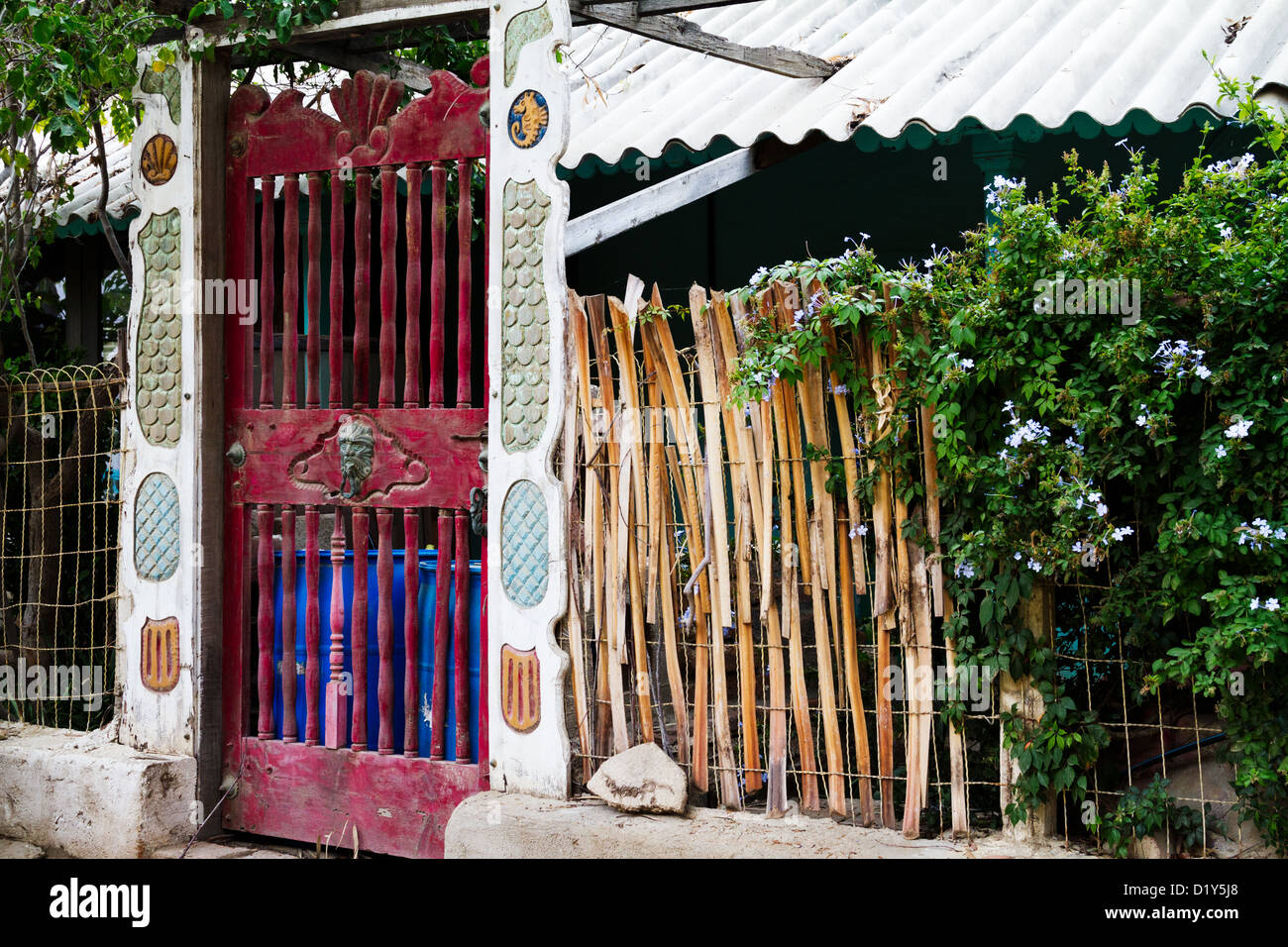 An ornate door decorates the entrance  to a house in Todos Santos, Baja, Mexico Stock Photo