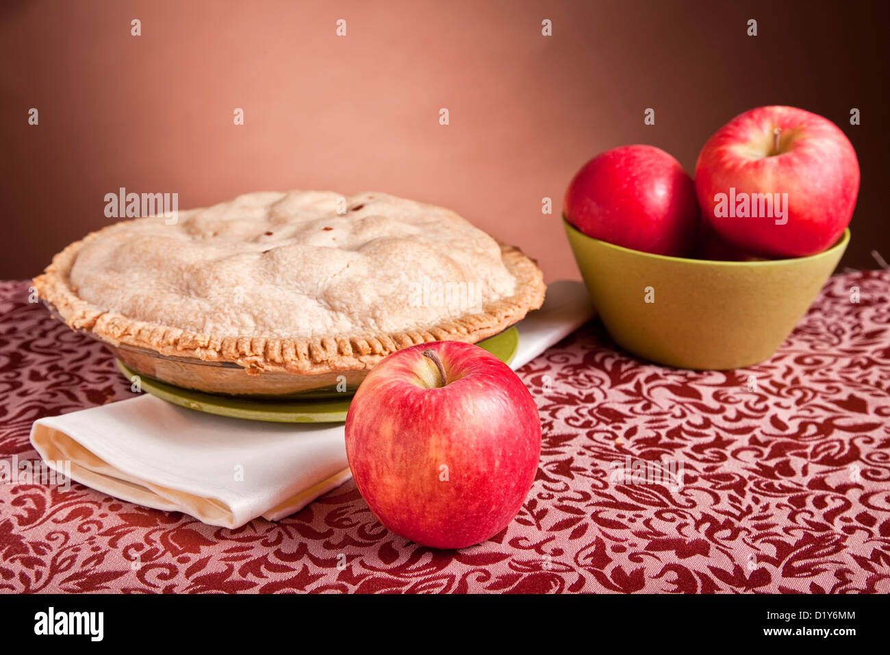 Apples and a freshly baked apple pie. Stock Photo