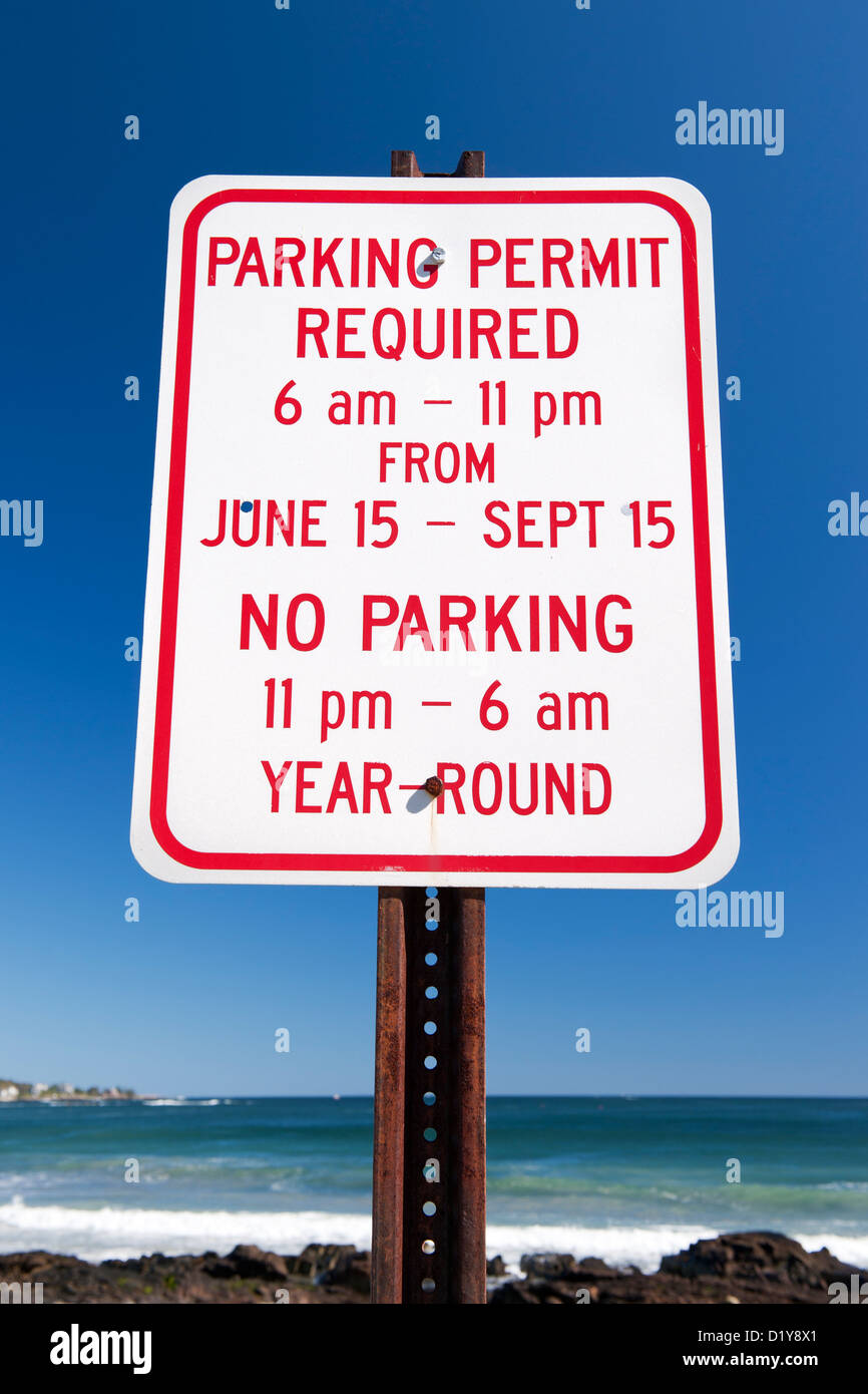 'Parking permit required' traffic sign against a blue sky. Stock Photo