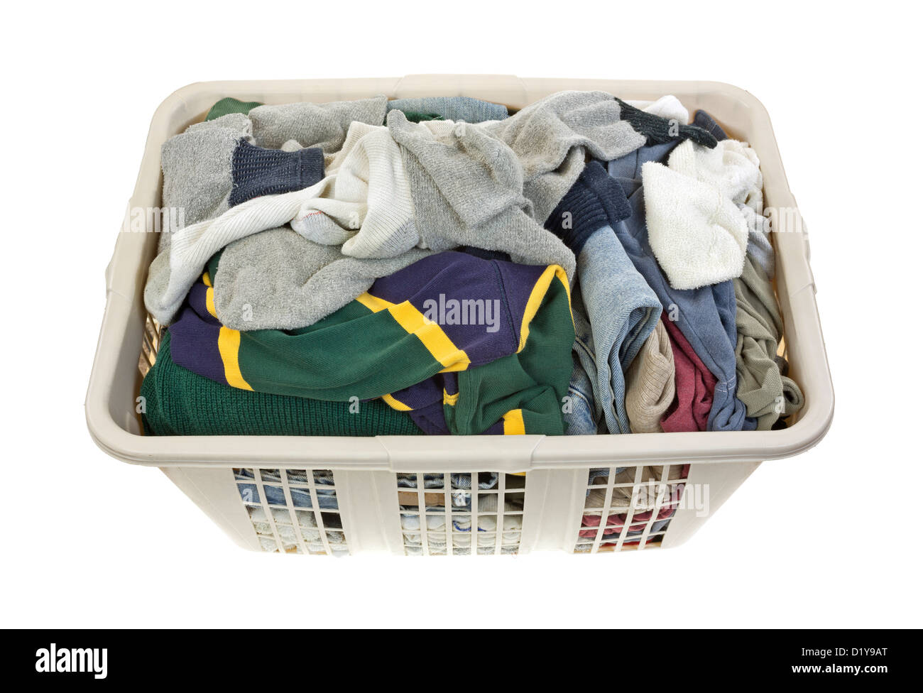 A load of men's clothing freshly laundered in a plastic hamper on a white background. Stock Photo