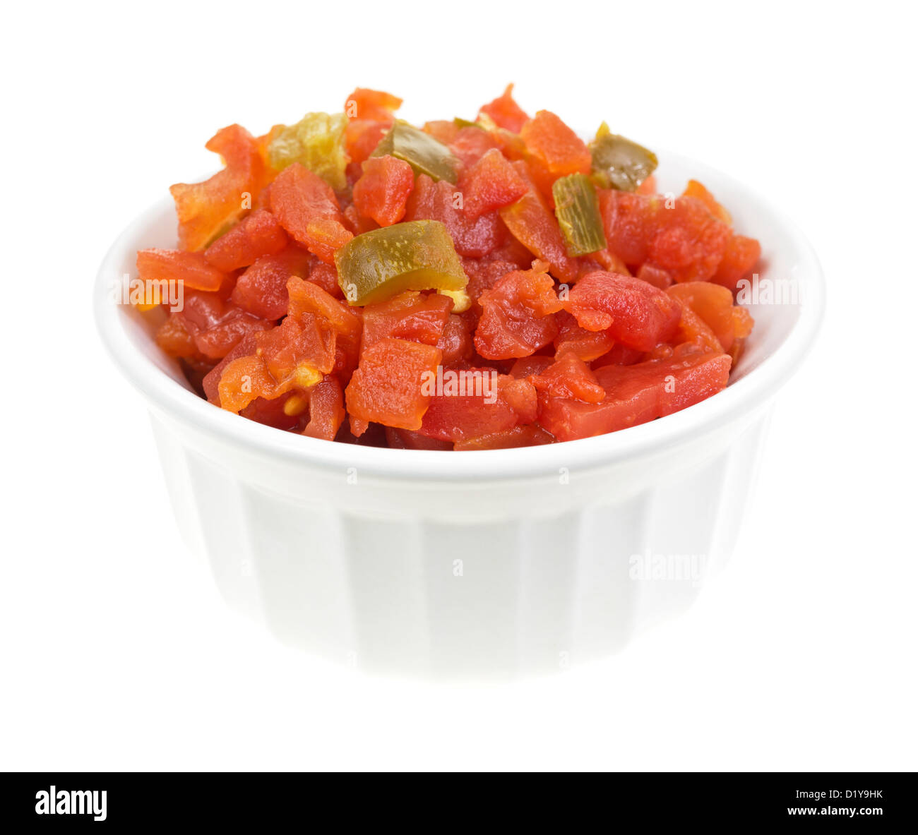 A small bowl filled with diced tomatoes and green peppers on a white background. Stock Photo
