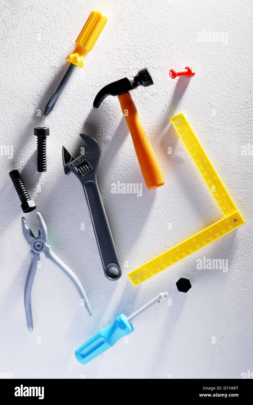 Playing toys set of repair tools like screwdriver, hammer, wrench, made from plastic. Repair tools for kids Stock Photo