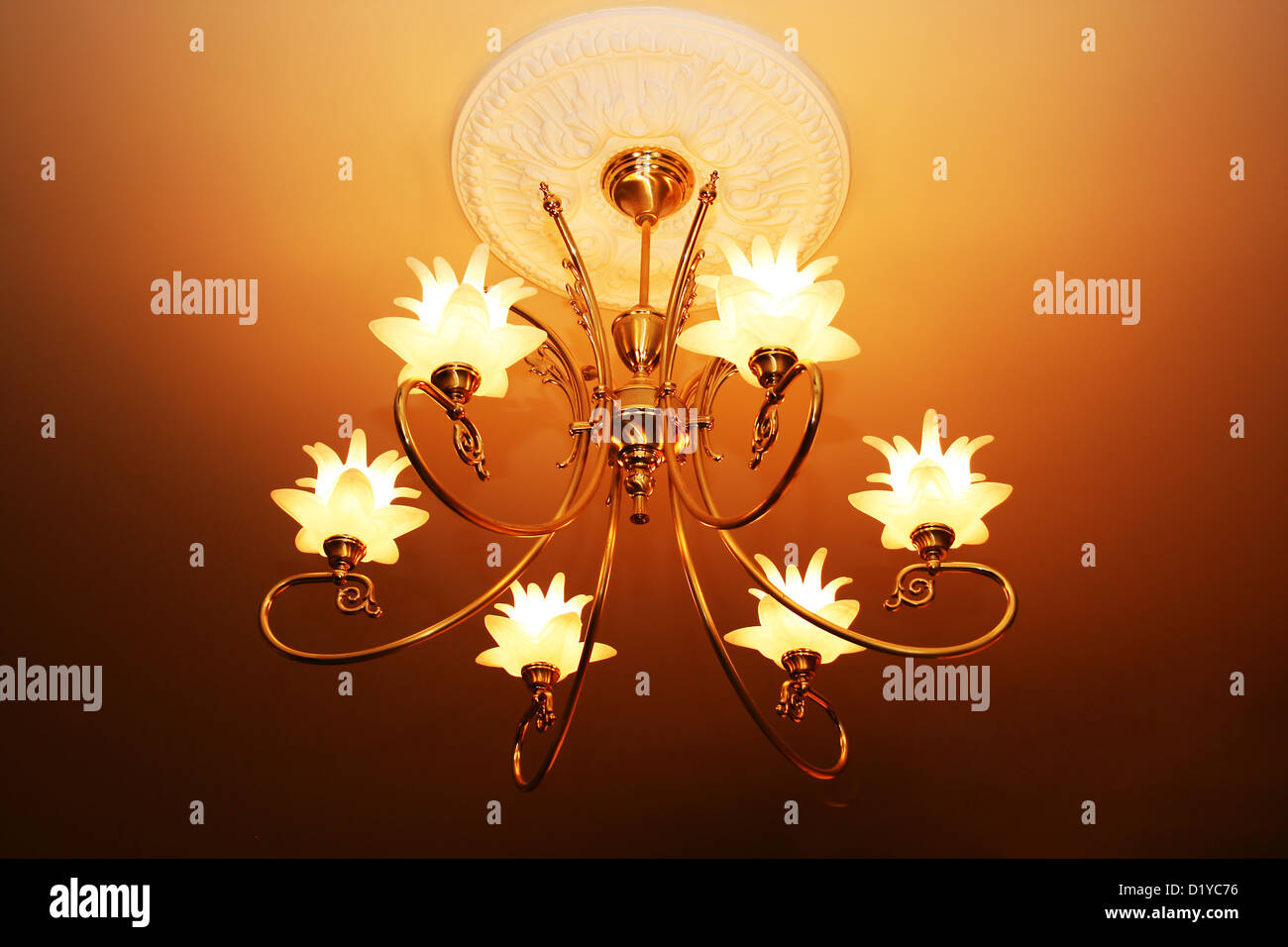 Luxurious chandelier hanging from ceiling Stock Photo Alamy