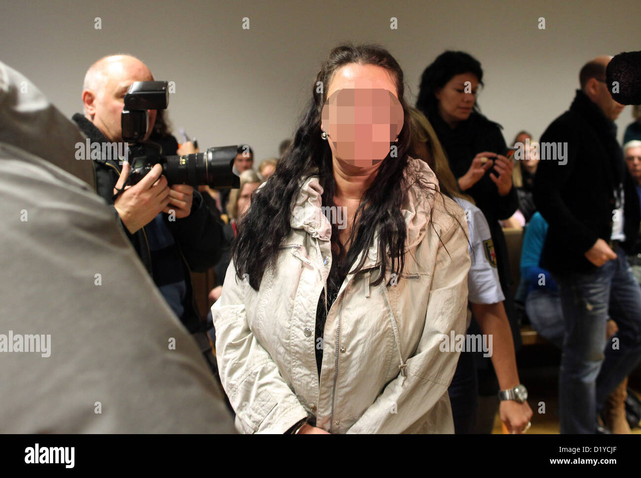 The defendant Melanie-Christin M. B. enters the County Court of Koblenz, Germany, 8 January 2013. She and her partner are being accused to have taken the baby Michaela out of her stroller in front of the mother in Ústí nad Labem, Czech Republic, 4 July 2012. For days any tracks of the infant were missing until she was found in good conditions in an apartment in Koblenz, Germany. Photo: Thomas Frey Stock Photo