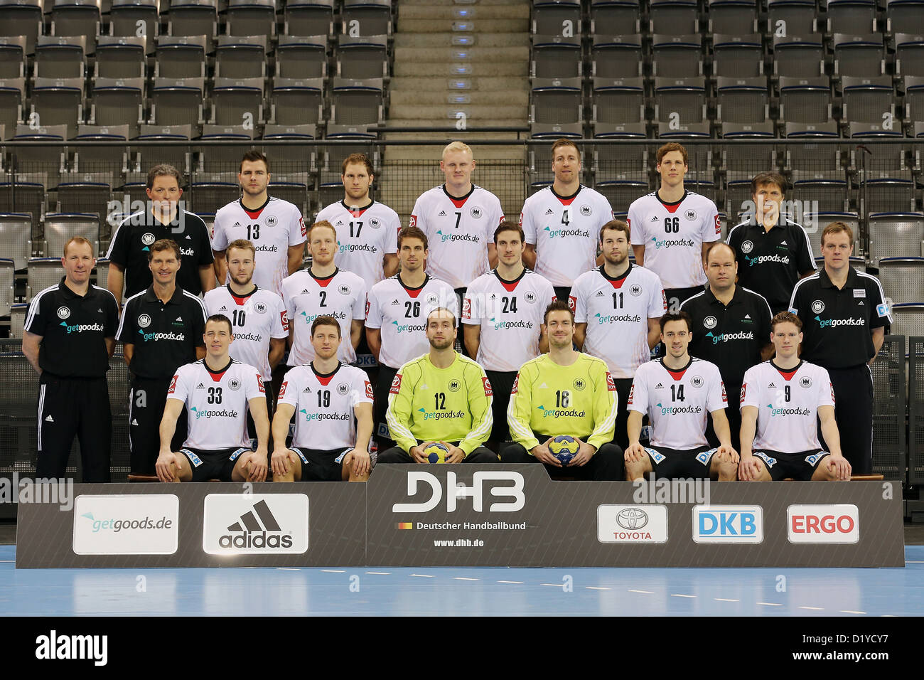 Germany's (behind L-R) team coordinator Tom Schneider Christoph Theuerkauf Steffen Weinhold Patrick Wiencek Oliver Roggisch Sven-Soeren Christophersen physiotherapist Reinhold Roth; (middle L-R) assistant coach Frank Carstens physiotherapist Peter Graeschus Kevin Schmidt Stefan Kneer, Adrian Pfahl Michael Haass Steffen Faeth team doctor Dr. Marco Kettrukat head coach Martin Heuberger; (front L-R) Dominik Klein Martin Strobel goalkeeper Silvio Heinevetter goalkeeper Carsten Lichtlein Patrick Groetzki Tobias Reichmann pose during photo session Porsche Arena in Stuttgart Germany 08 January 2013. Stock Photo