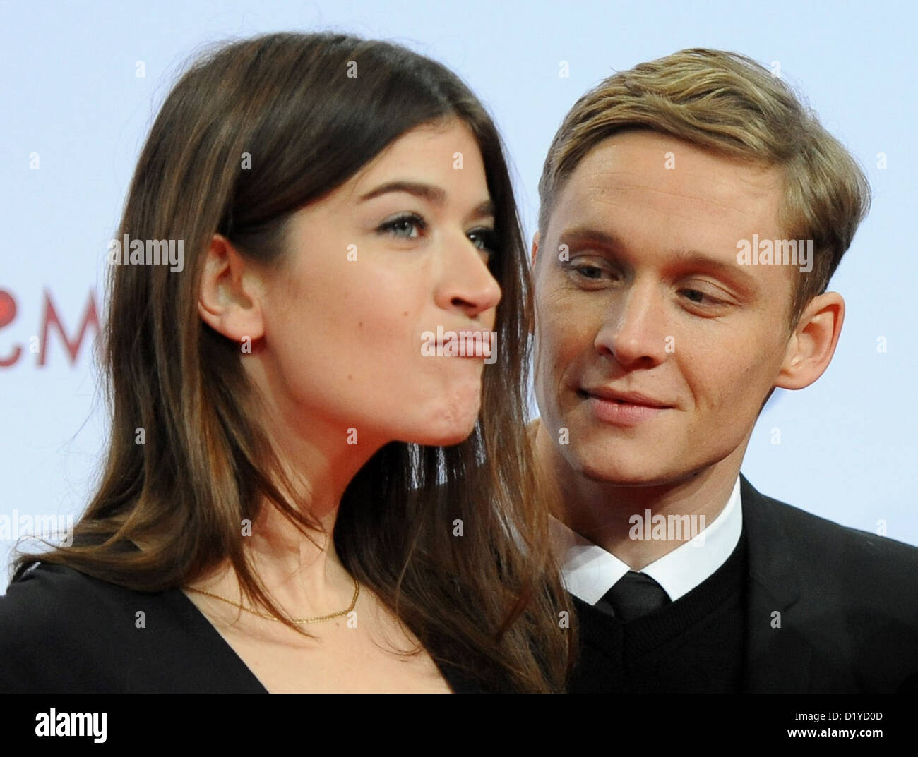 German actors Matthias Schweighoefer (R) and Anna Bederke arrive for