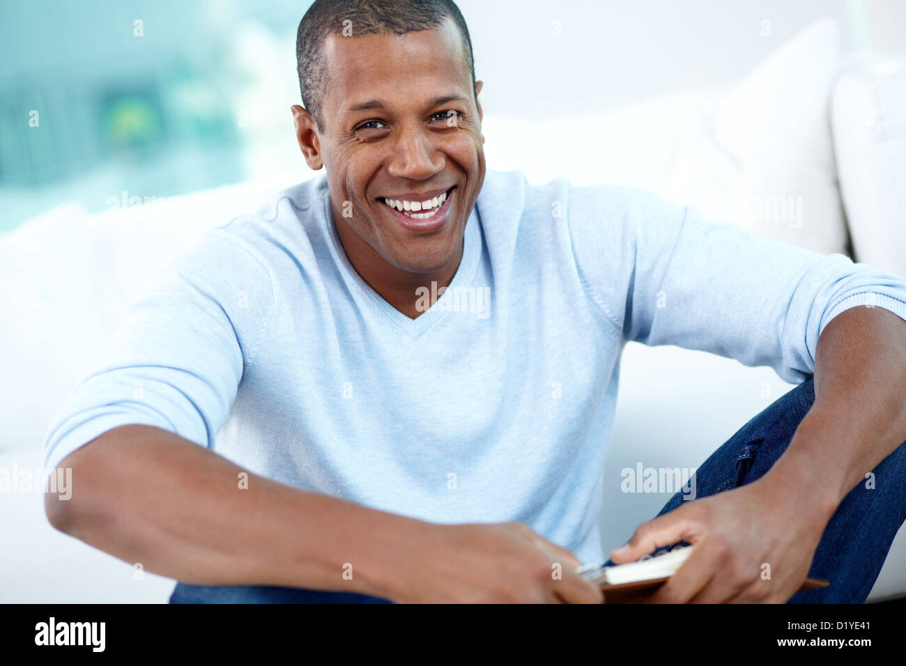 Image of young African man looking at camera with smile Stock Photo - Alamy
