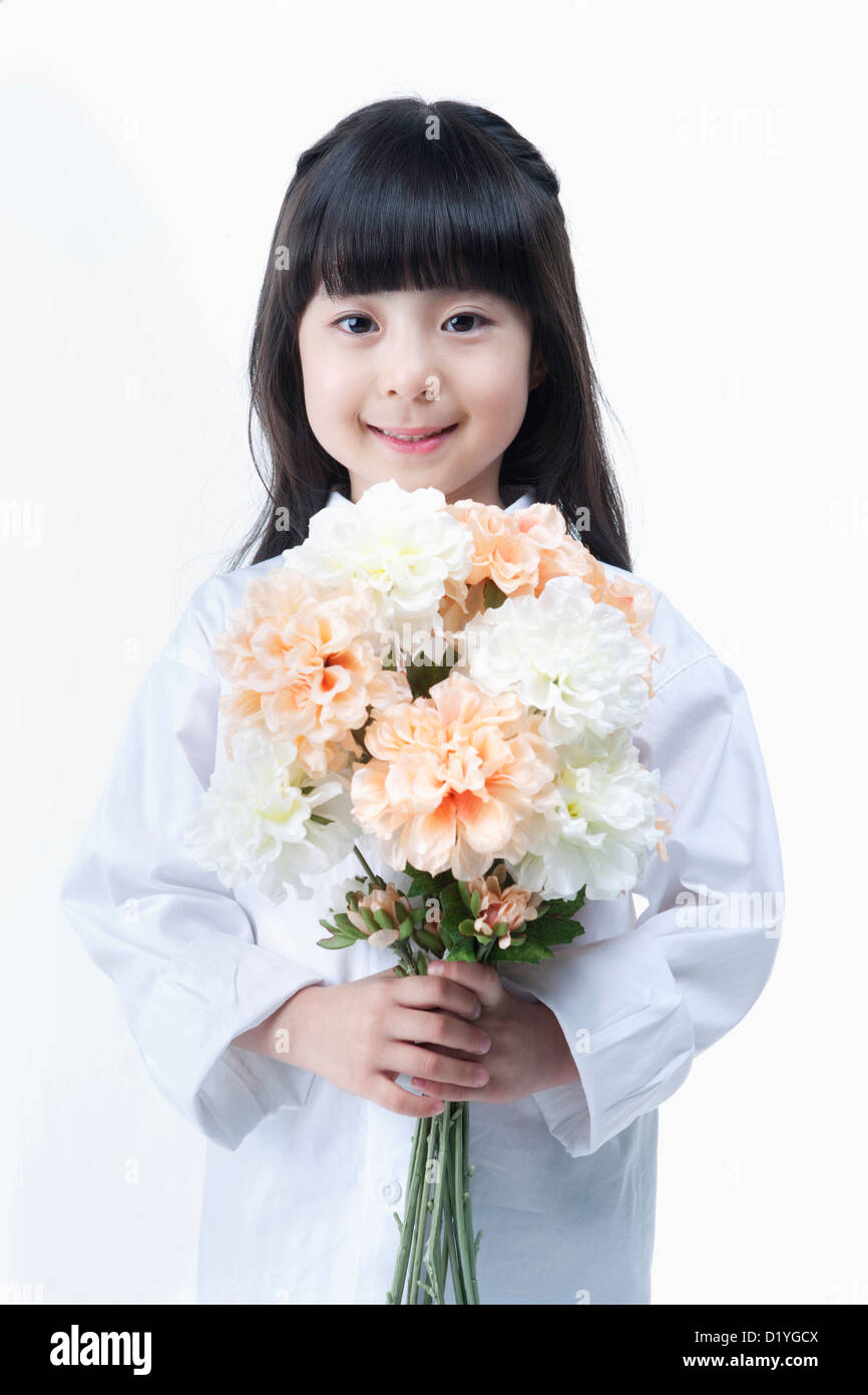 a young girl holding a bunch of flowers Stock Photo - Alamy