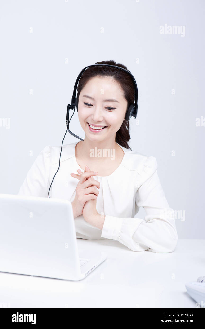 a telemarketer with hands together Stock Photo - Alamy