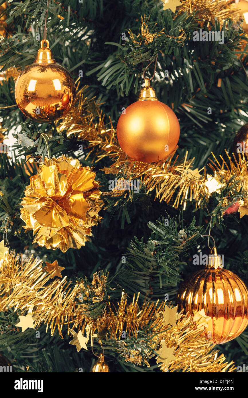 yellow decorated christmas tree on white background Stock Photo Alamy