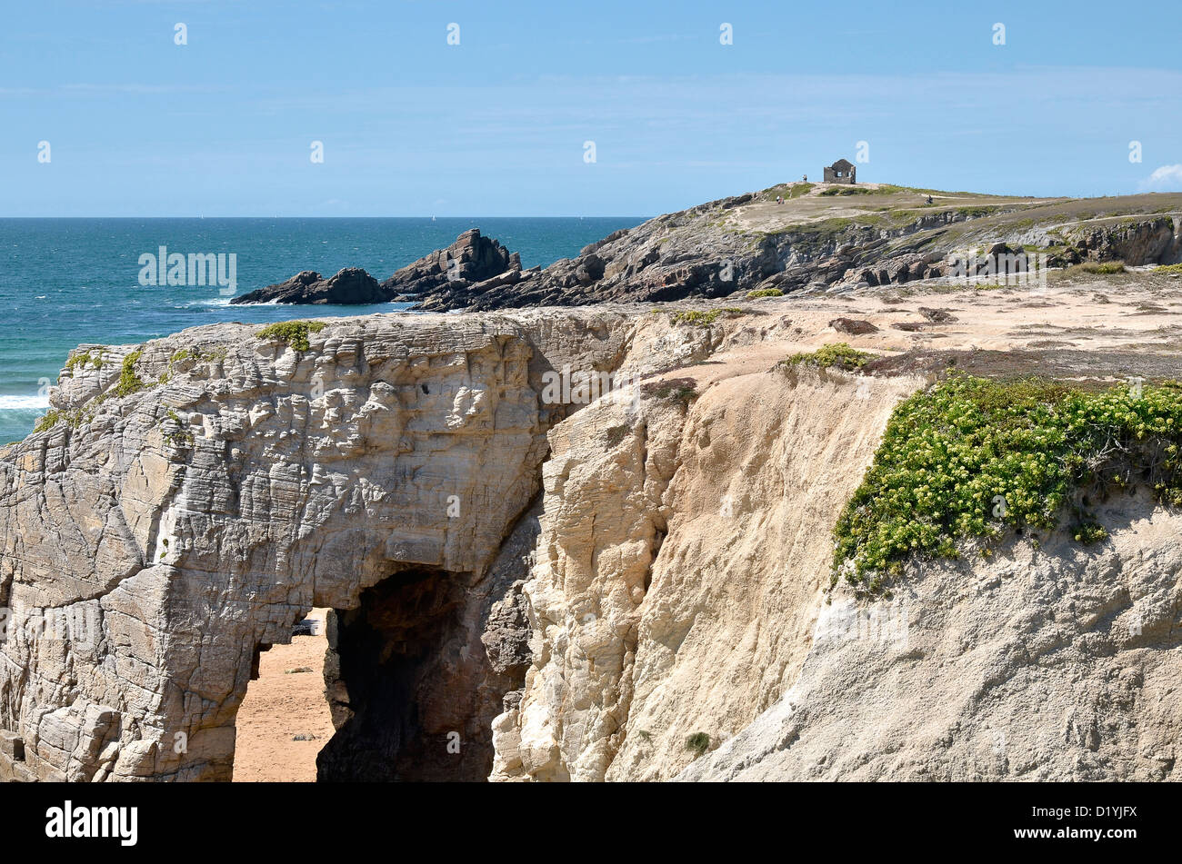 Wild Coast  (côte sauvage) of the peninsula of Quiberon with big hole in the cliff, the arche of Port Blanc, in the Morbihan Stock Photo