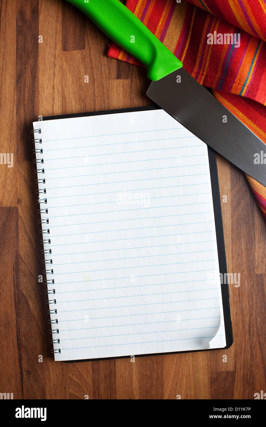 the blank recipe book and kitchen knife Stock Photo