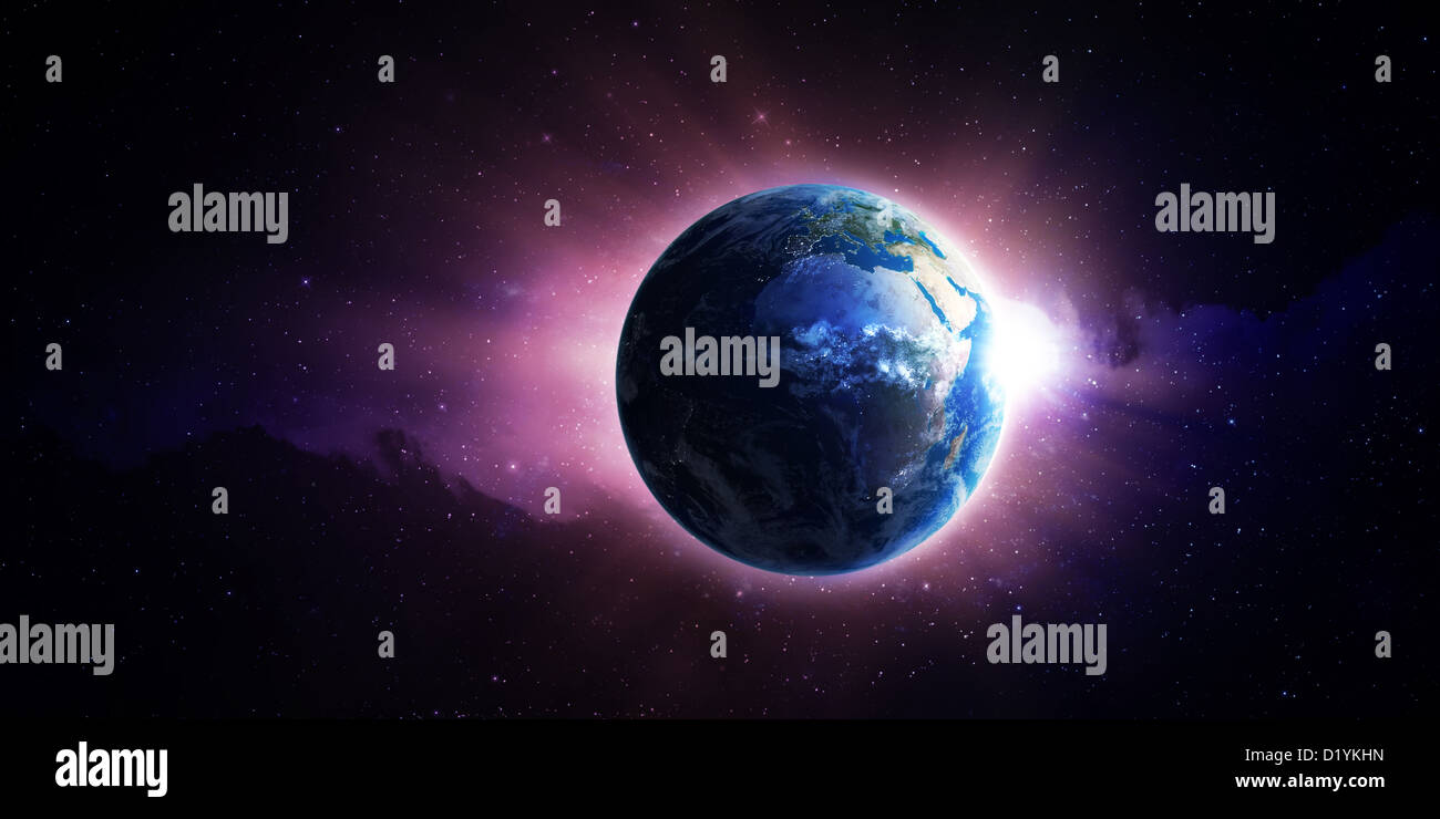 View from space of the Sun rising over Earth Stock Photo - Alamy