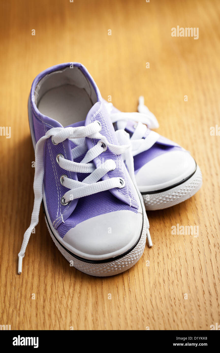 the colorful sneakers on wooden floor Stock Photo - Alamy
