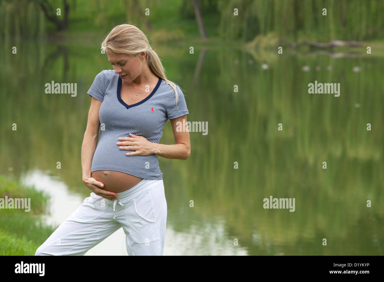 pregnant woman in the park Stock Photo - Alamy