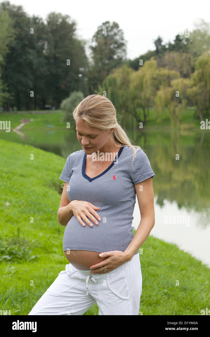 pregnant woman in the park Stock Photo - Alamy
