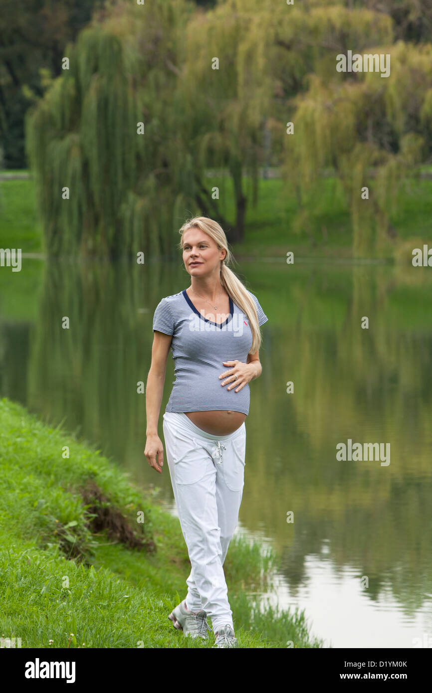 pregnant woman in the park Stock Photo - Alamy
