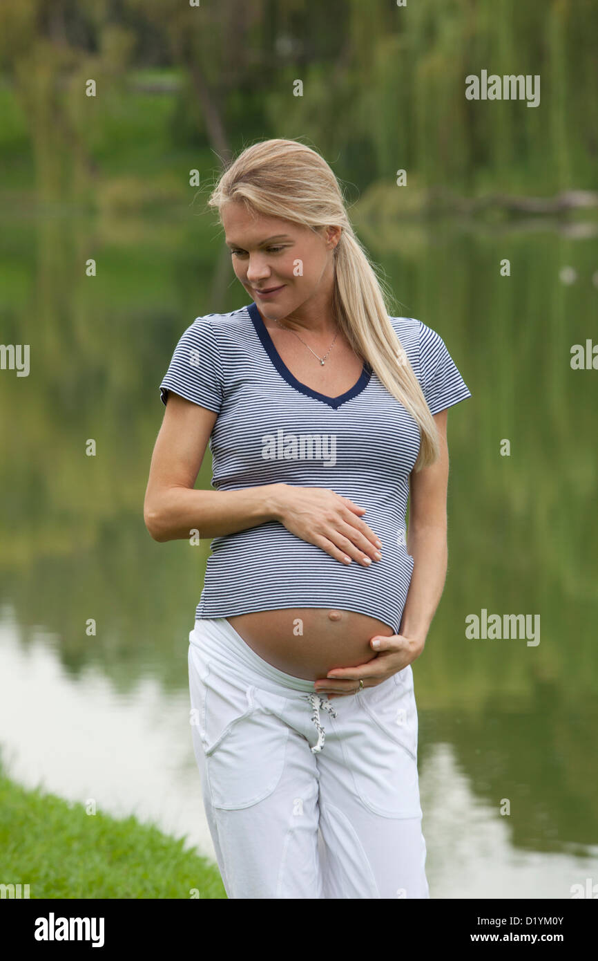 pregnant woman in the park Stock Photo - Alamy