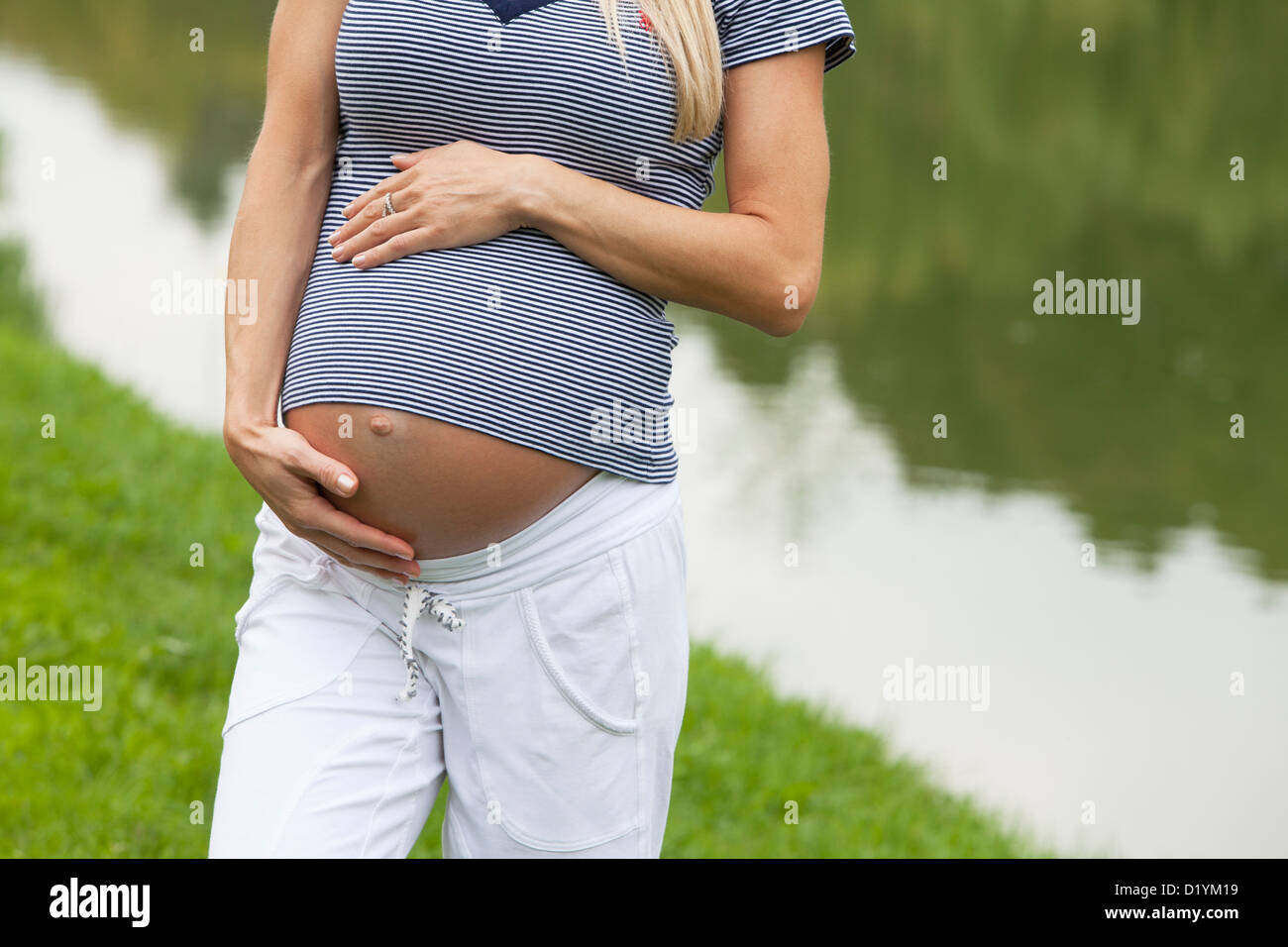 pregnant woman in the park Stock Photo - Alamy