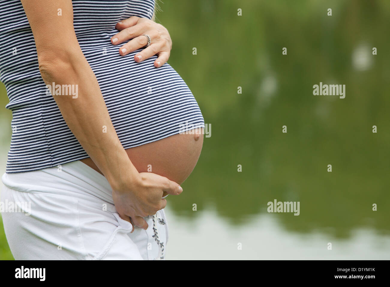 pregnant woman in the park Stock Photo - Alamy