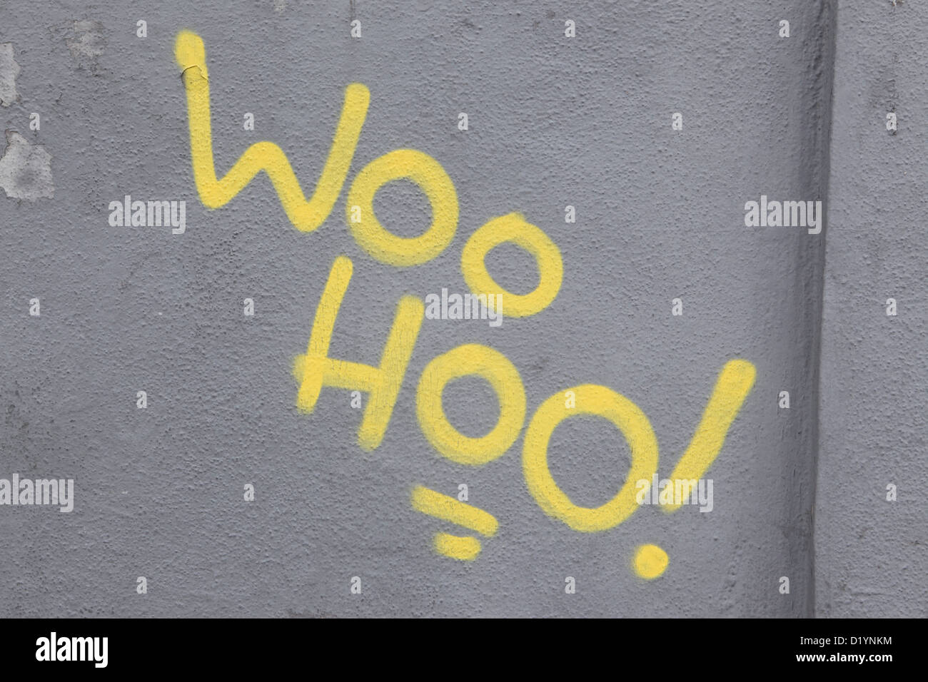 Graffiti on gray wall, 'Woo Hoo!' exclamation joy joyous fun, Puerto de la Cruz, Tenerife, Canary Islands. Stock Photo