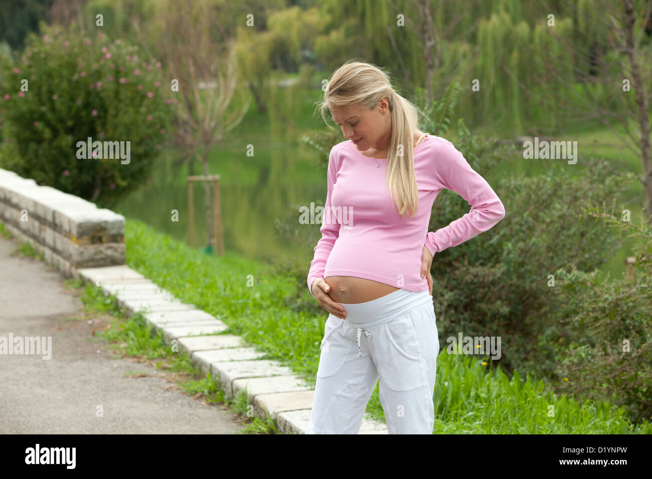 pregnant woman in the park Stock Photo - Alamy