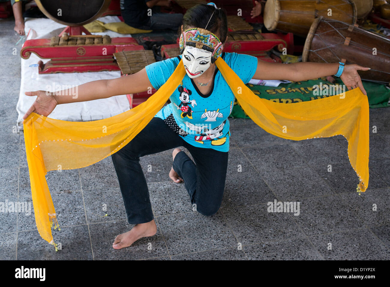 A dance student practices moves for a Javanese court dance at the Padepokan Seni Mangun Dharma Centre in Malang, Java, Indonesia Stock Photo