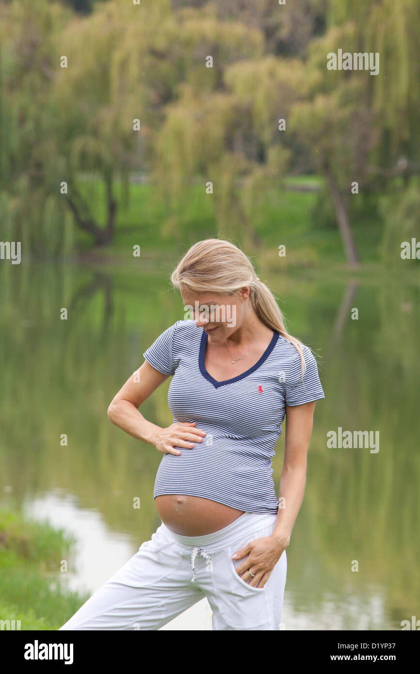 pregnant woman in the park Stock Photo - Alamy