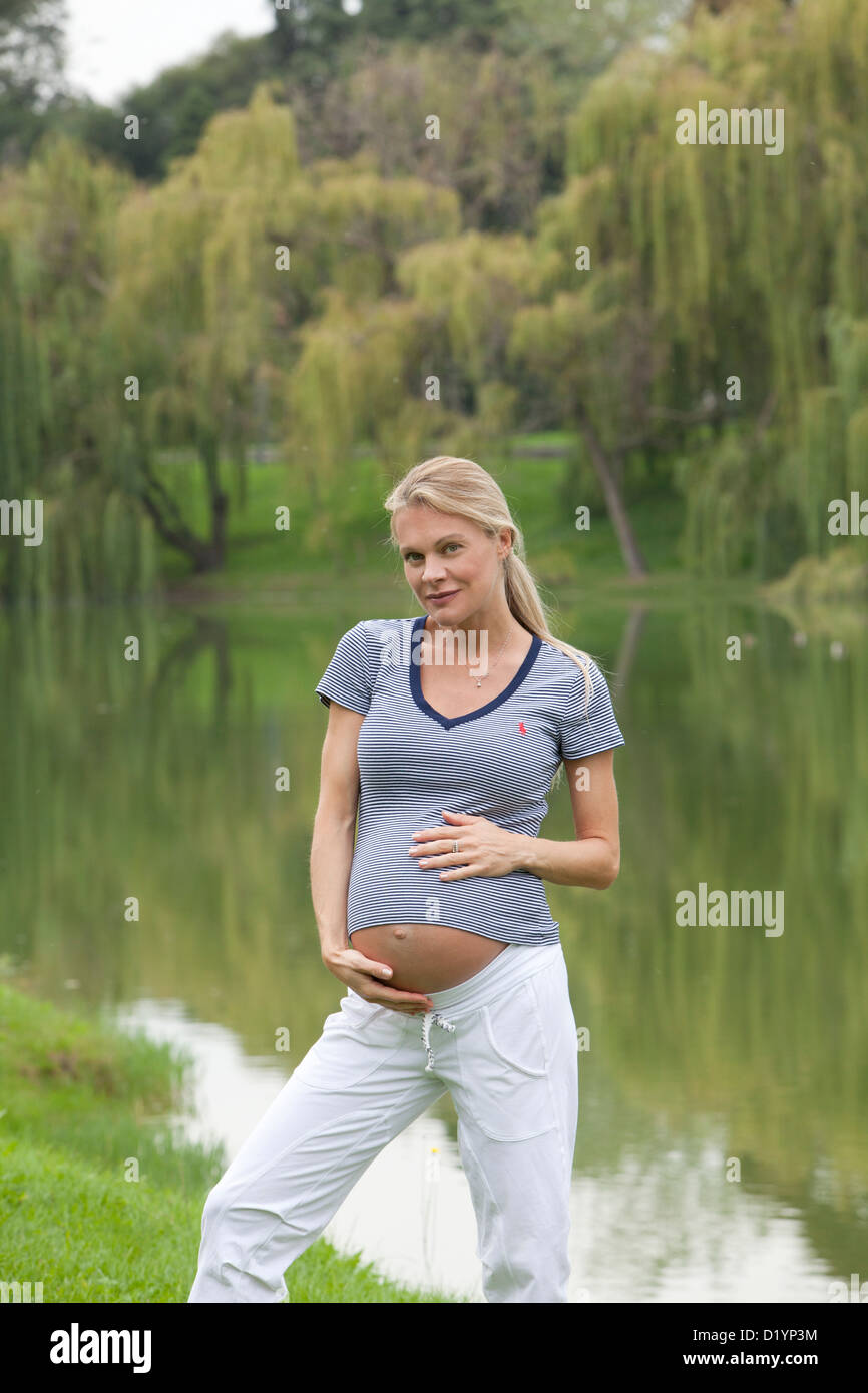 pregnant woman in the park Stock Photo - Alamy