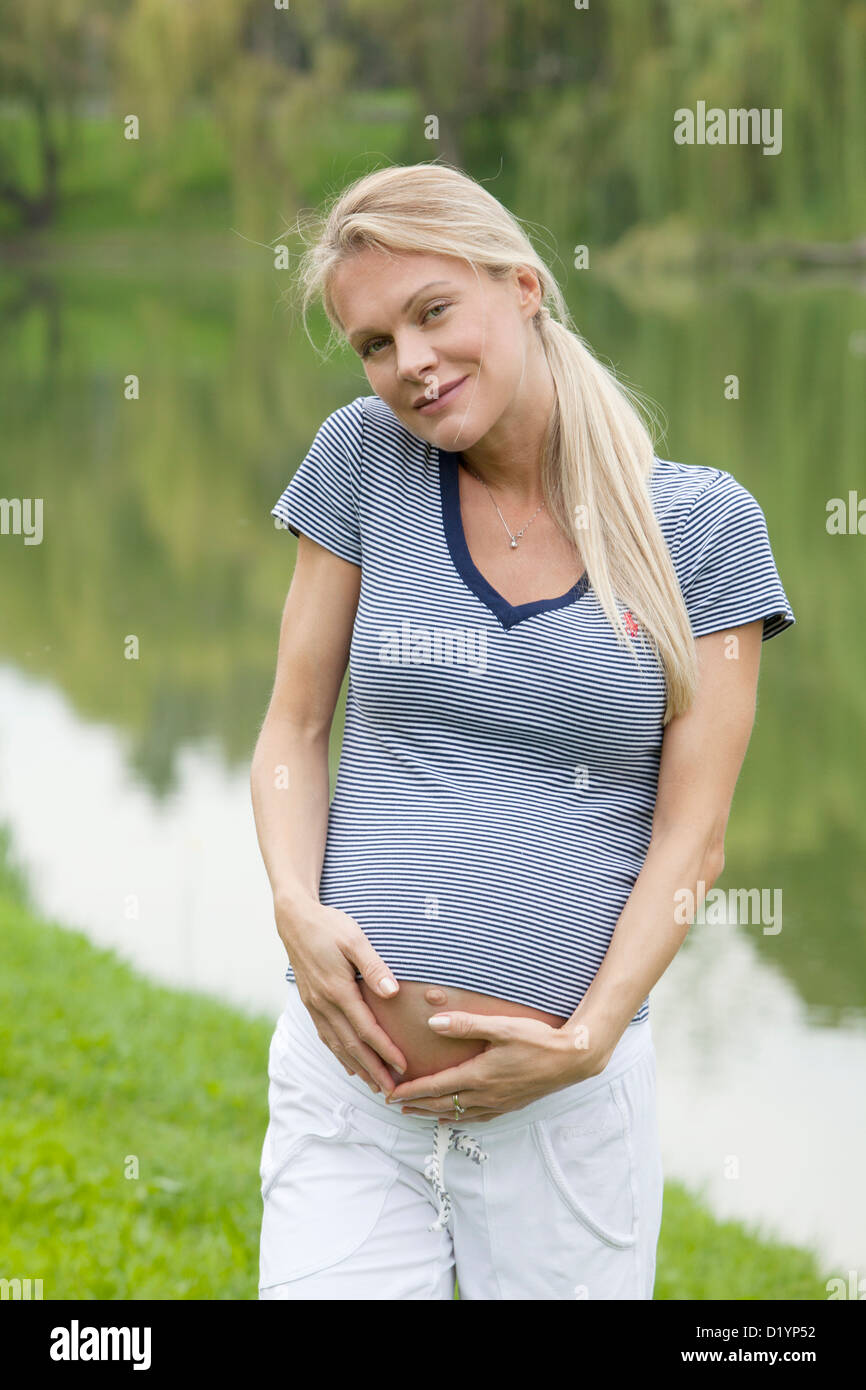 pregnant woman in the park Stock Photo - Alamy