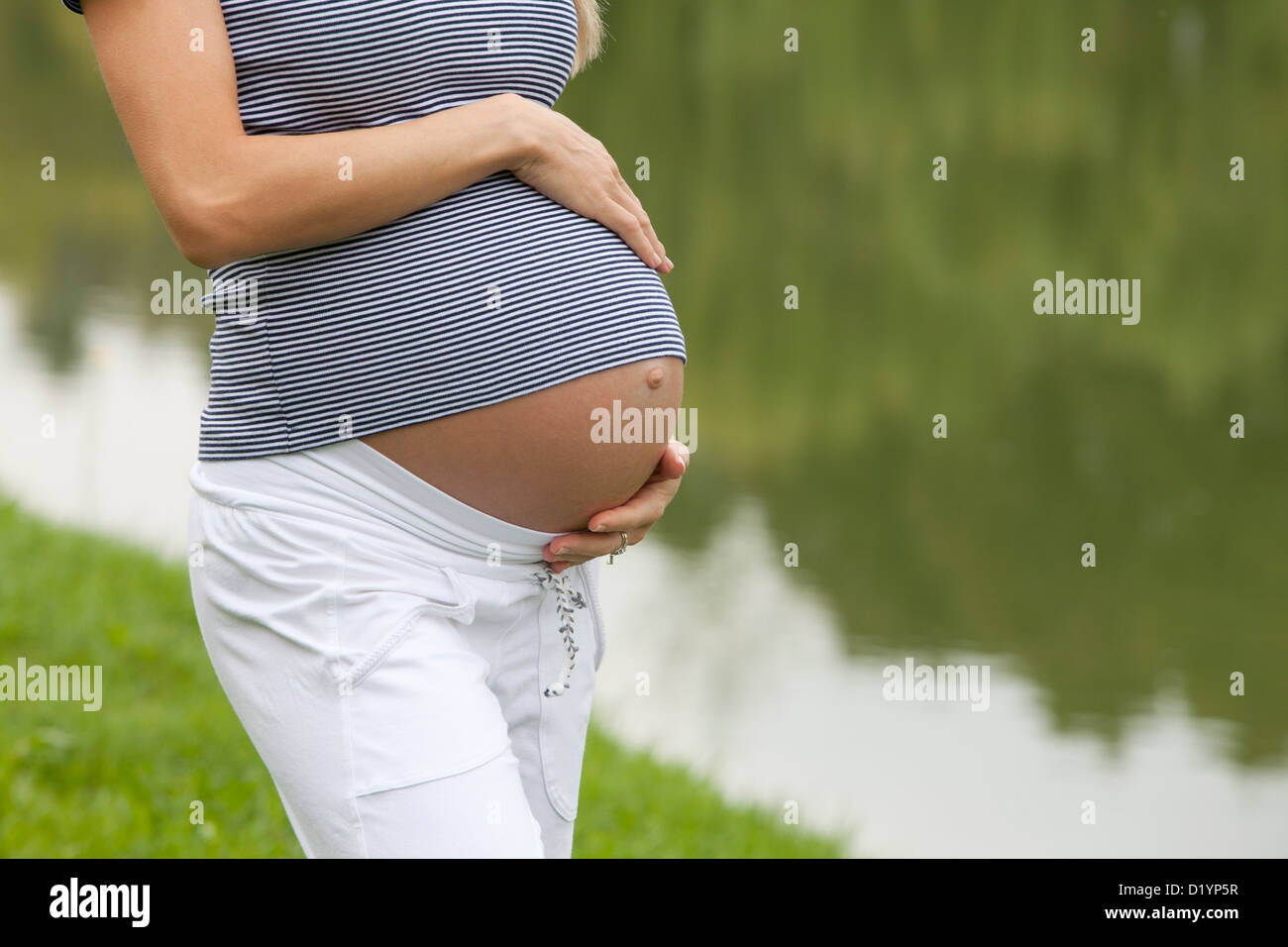 pregnant woman in the park Stock Photo - Alamy