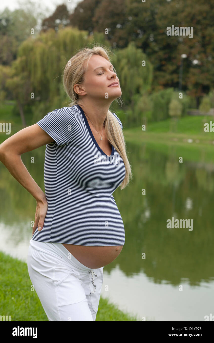 pregnant woman in the park Stock Photo - Alamy