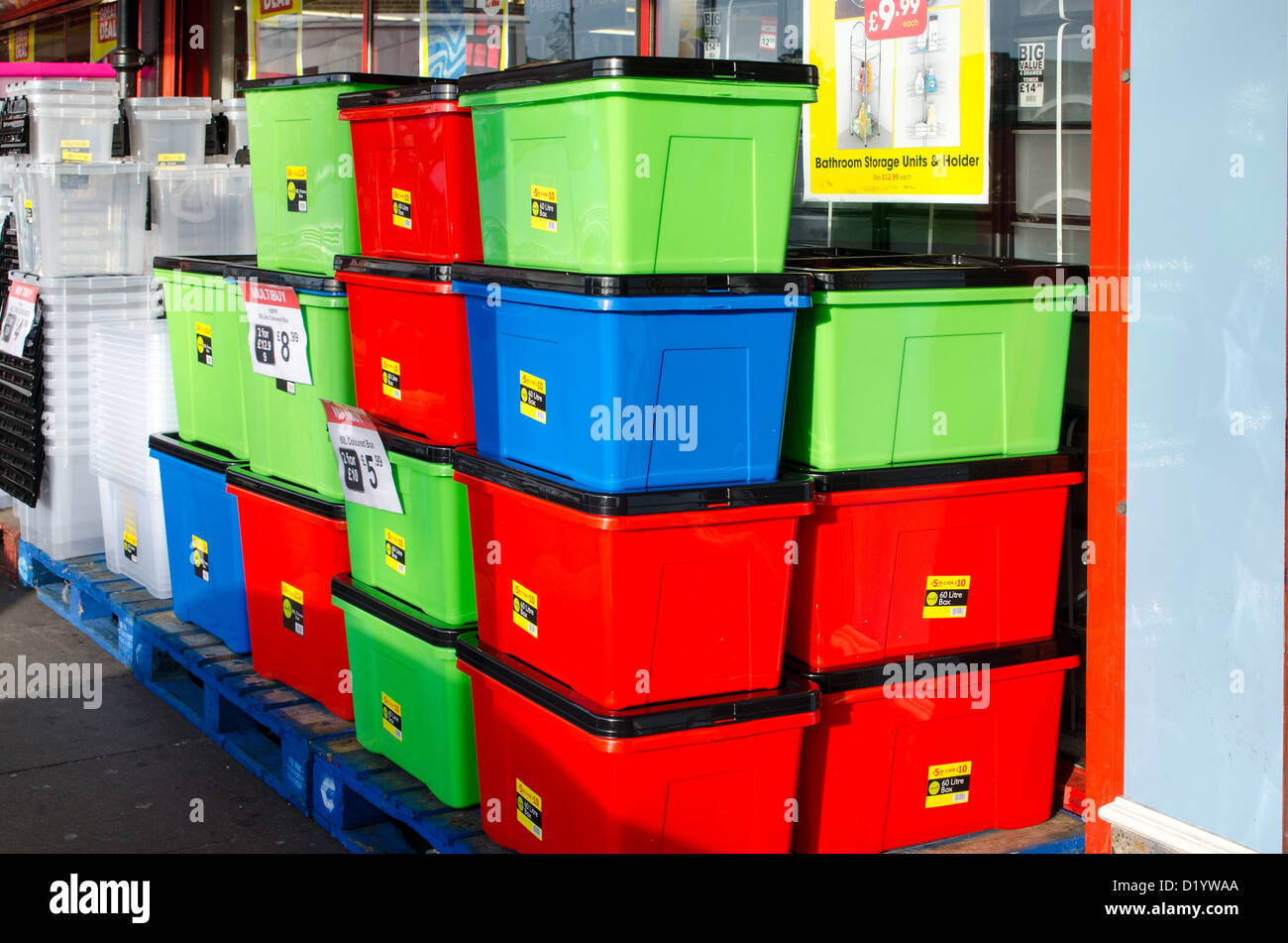 Stacks of colourful storage crates outside a shop Stock Photo Alamy