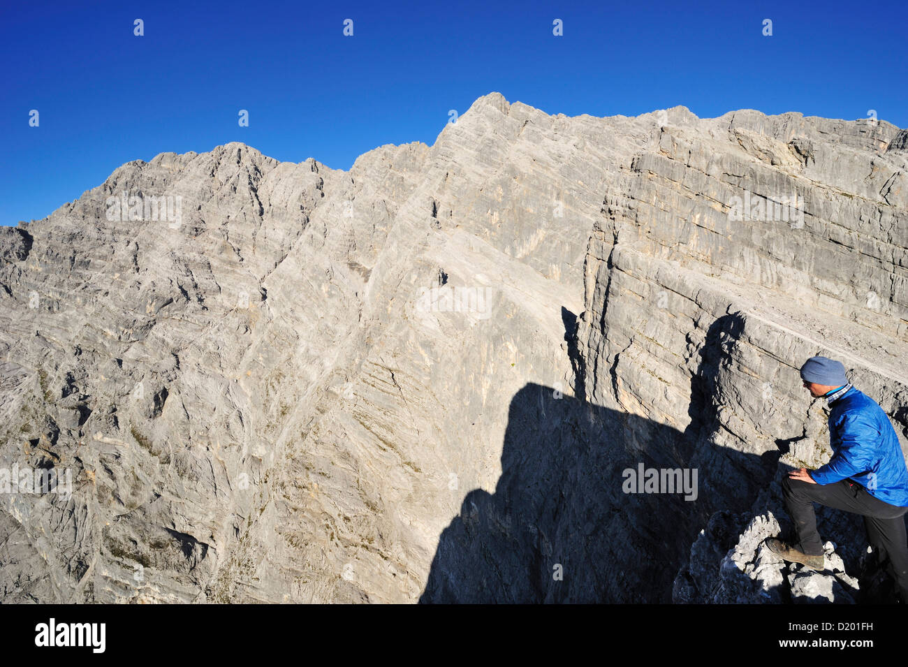 Man looking towards Watzmann Eastface, Third Watzmannkind, Watzmann, Berchtesgaden National Park, Berchtesgaden Alps, Upper Bava Stock Photo