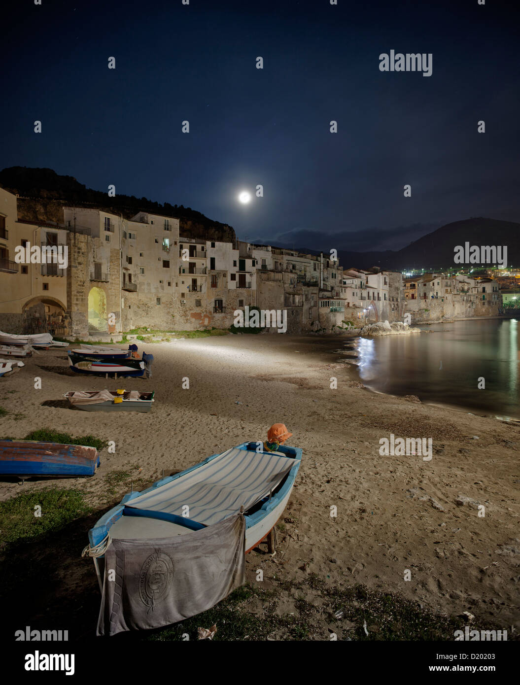 View across the beach towards the historic town of Cefalu, Province of Palermo, Sicily, Italy Stock Photo