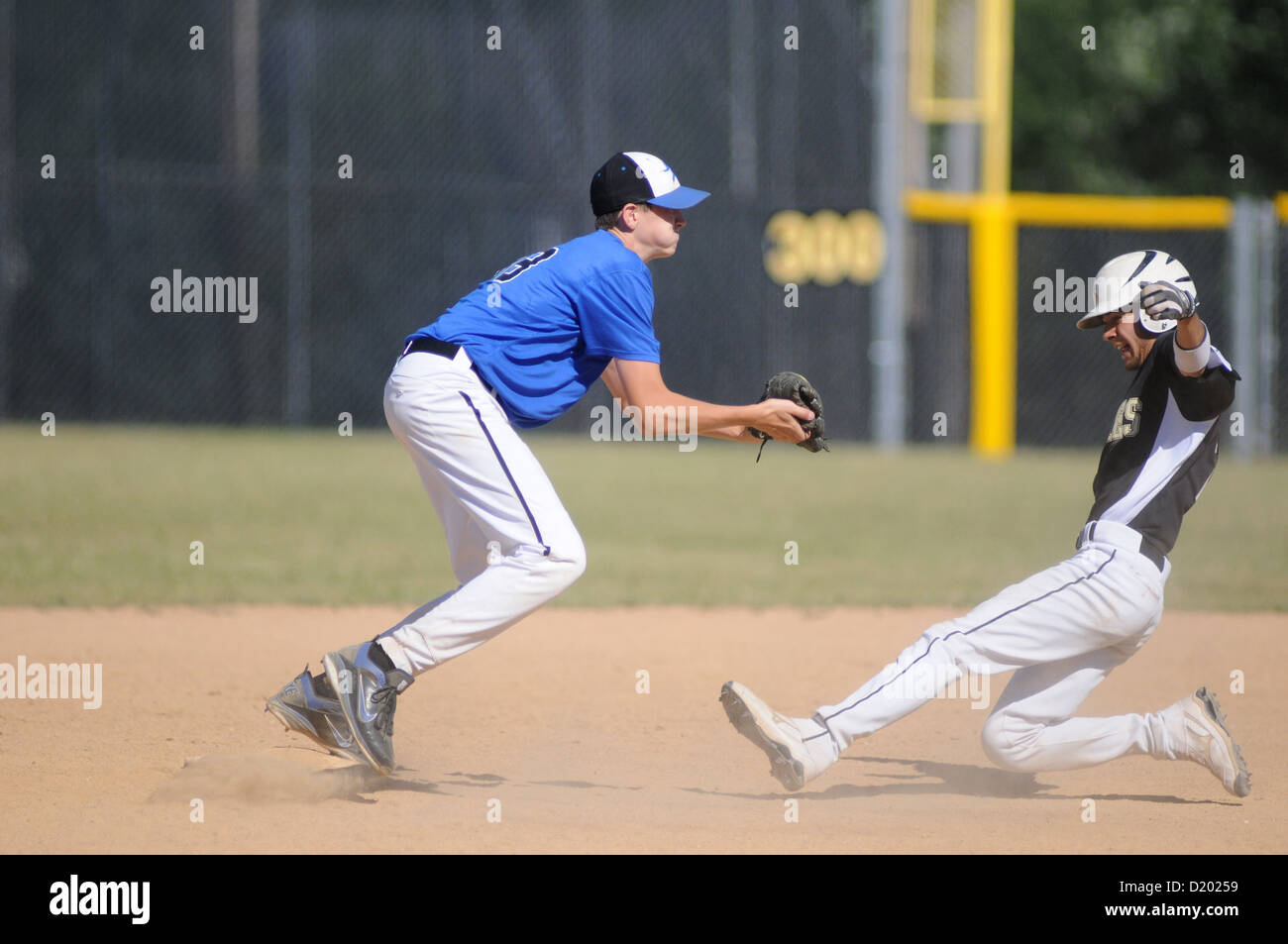 Baseball Middle infielder takes a throw to force out a sliding base runner  high school game. USA Stock Photo - Alamy