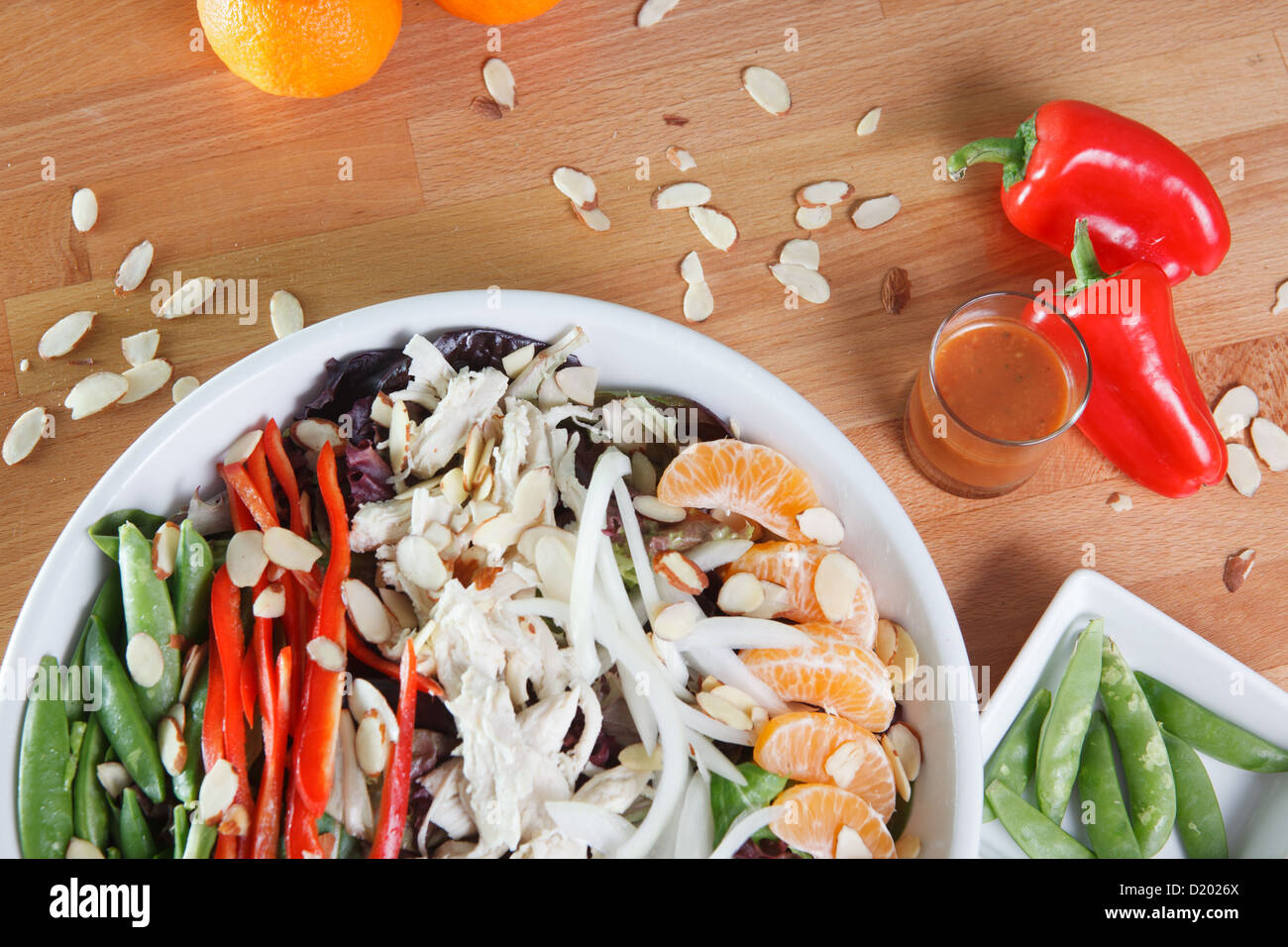 Entree sized Asian salad with chicken, bell peppers, tangerines, almonds, and much  more Stock Photo