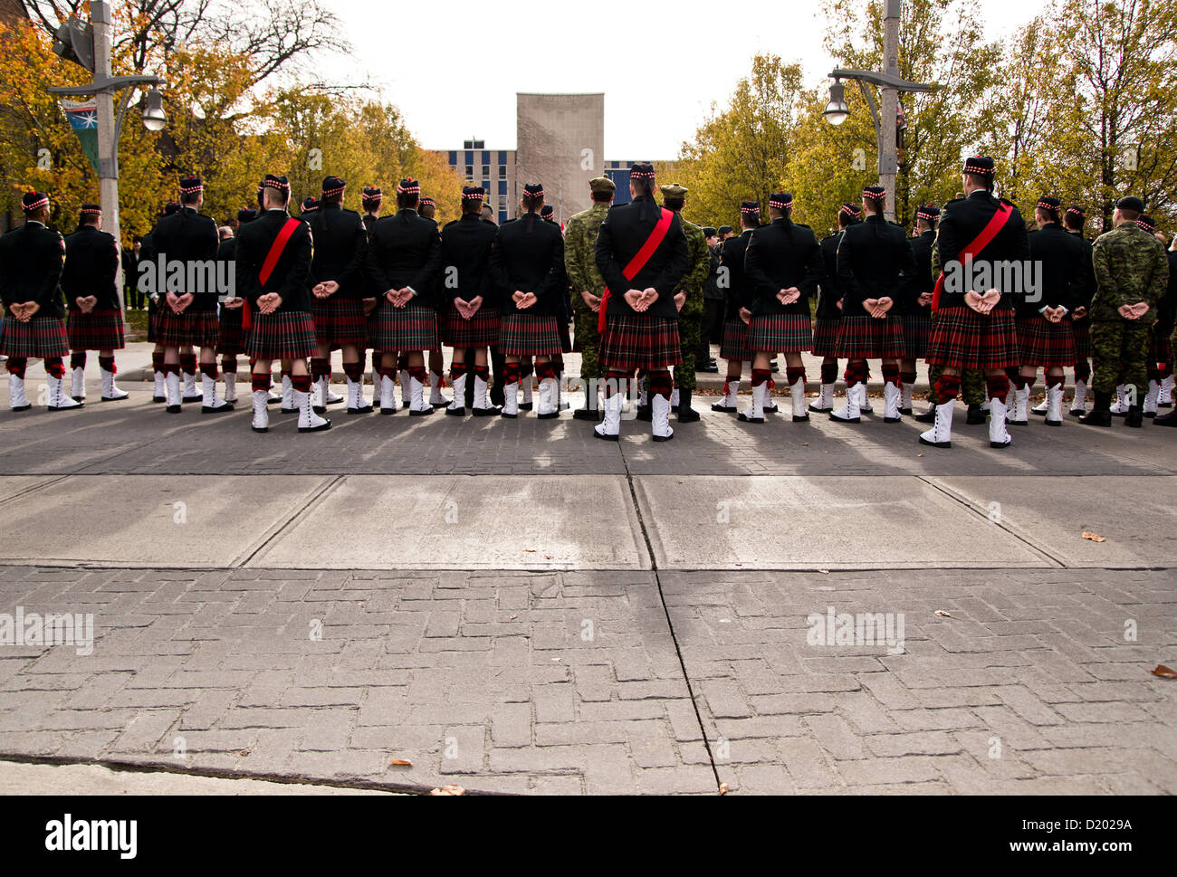 I crowd of uniformed soldiers in kilt's during a Remembrance Day ceremony in Windsor, Ontario, Canada. Stock Photo