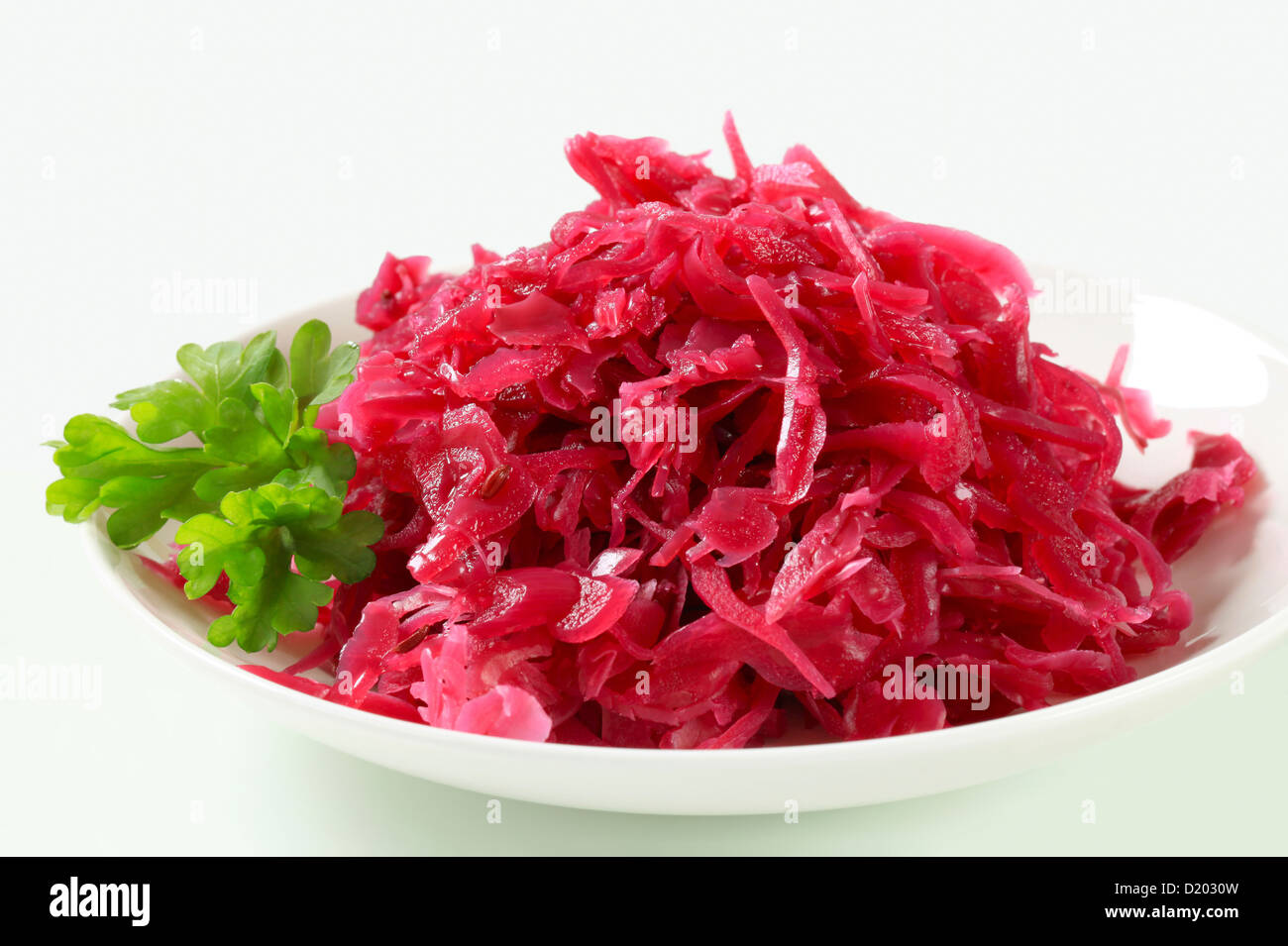 Serving of red kraut on plate Stock Photo