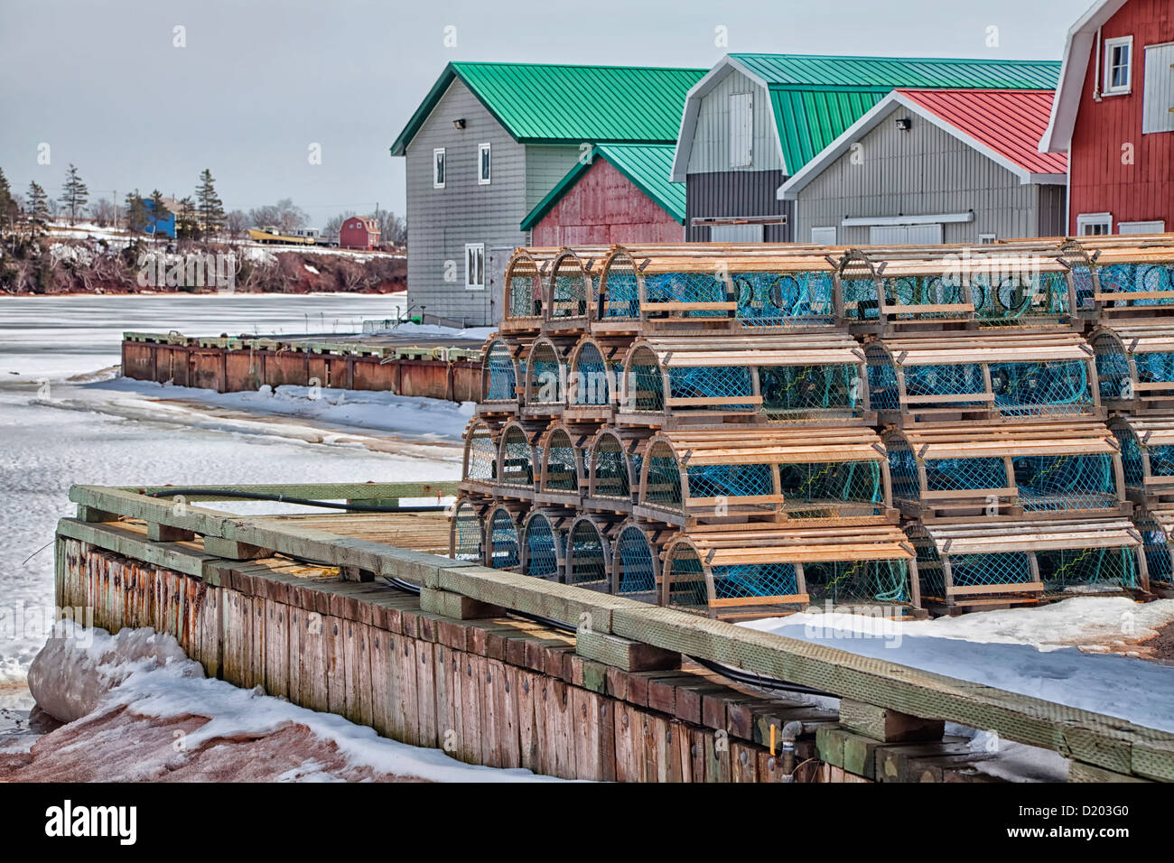 Winter view of lobster traps stacked up on the wharf of French River