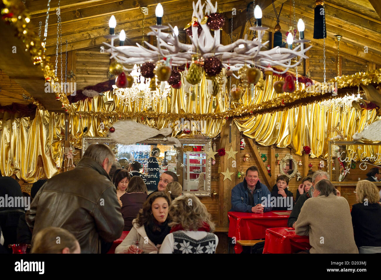 People inside a hut at the Christmas market, Basel, Switzerland Stock Photo