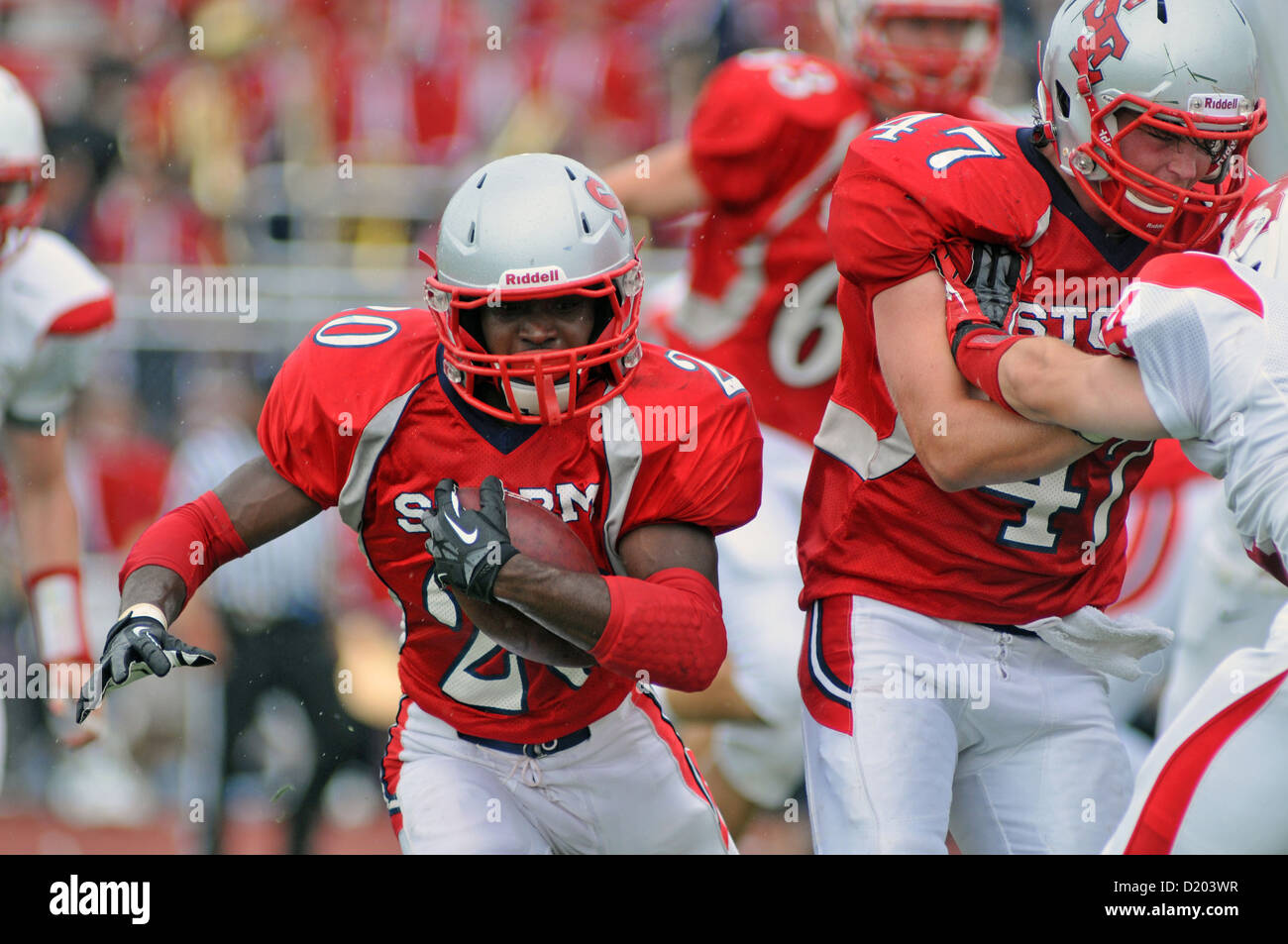 Football running back breaks to the outside during a high school game