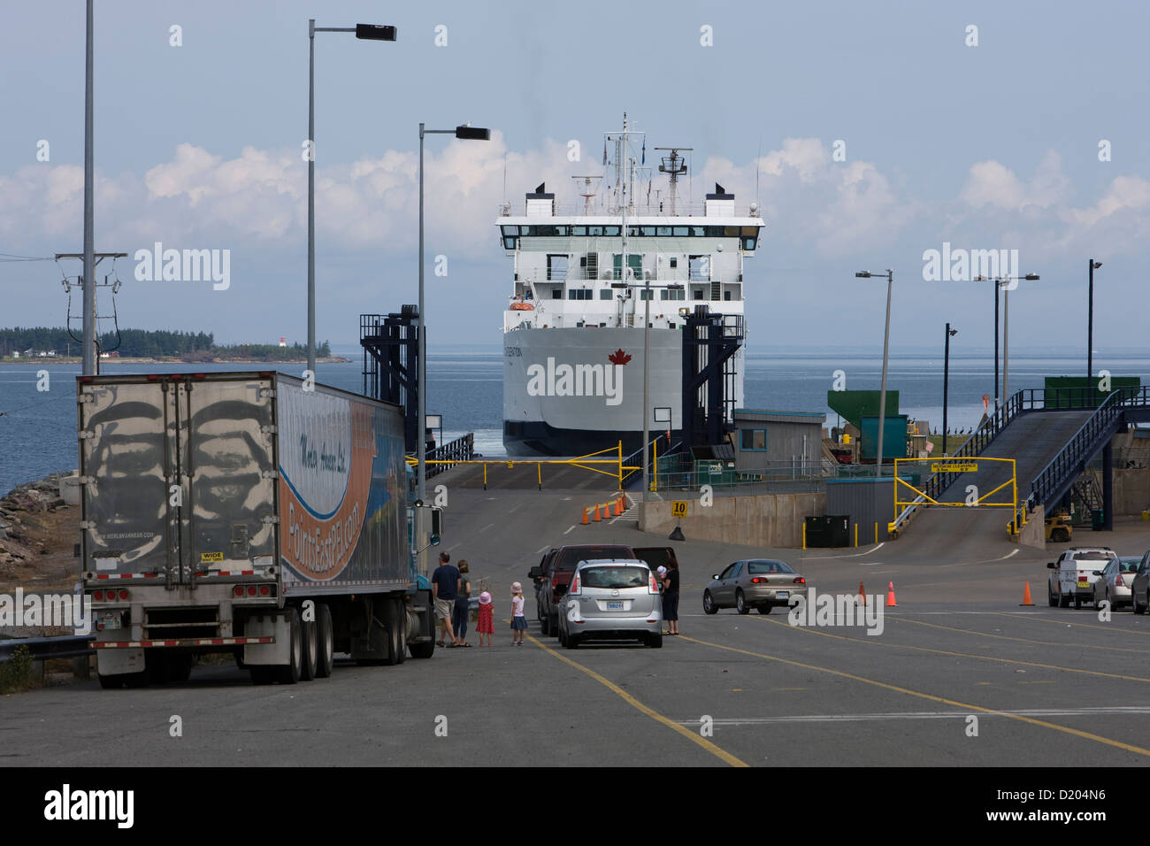 People, cars and lorries waiting for the Prince Edward Island Ferry in