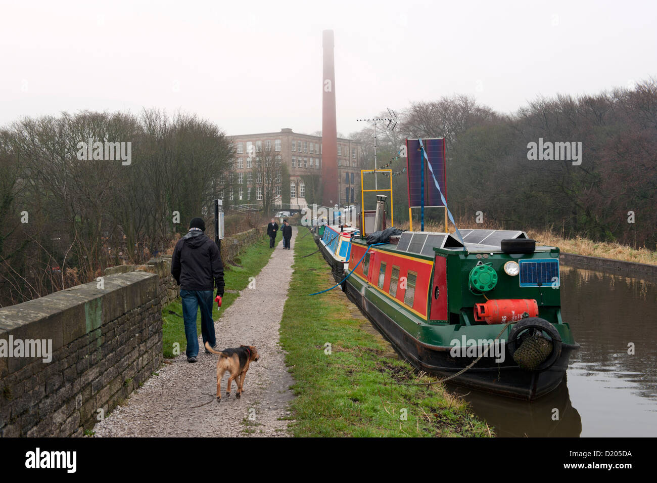 Bollington, Cheshire, UK. Aqueduct carrying the Macclesfield Canal, with the converted Clarence Mill in the distance. Stock Photo