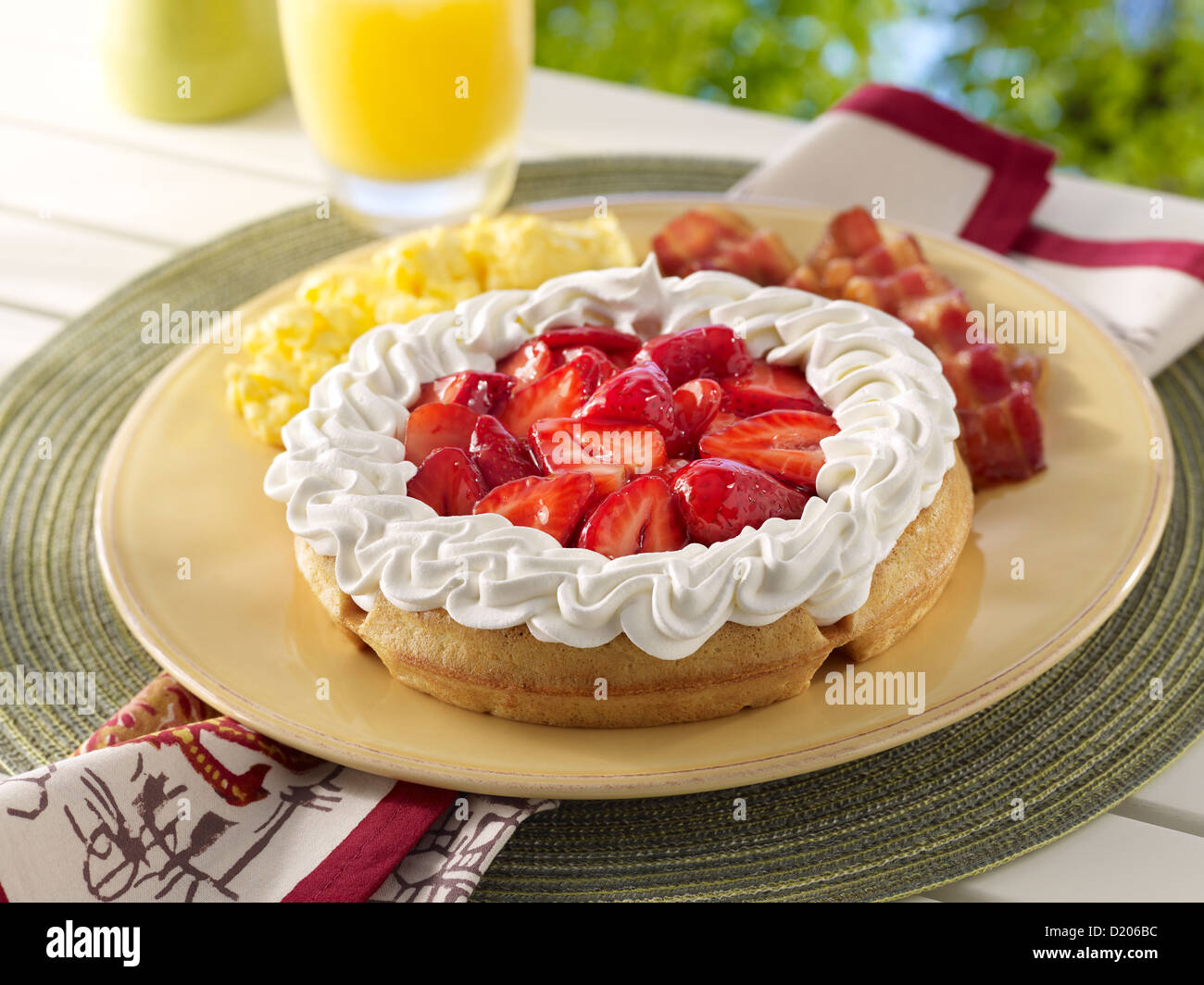 Strawberry waffle breakfast in an outdoor setting Stock Photo