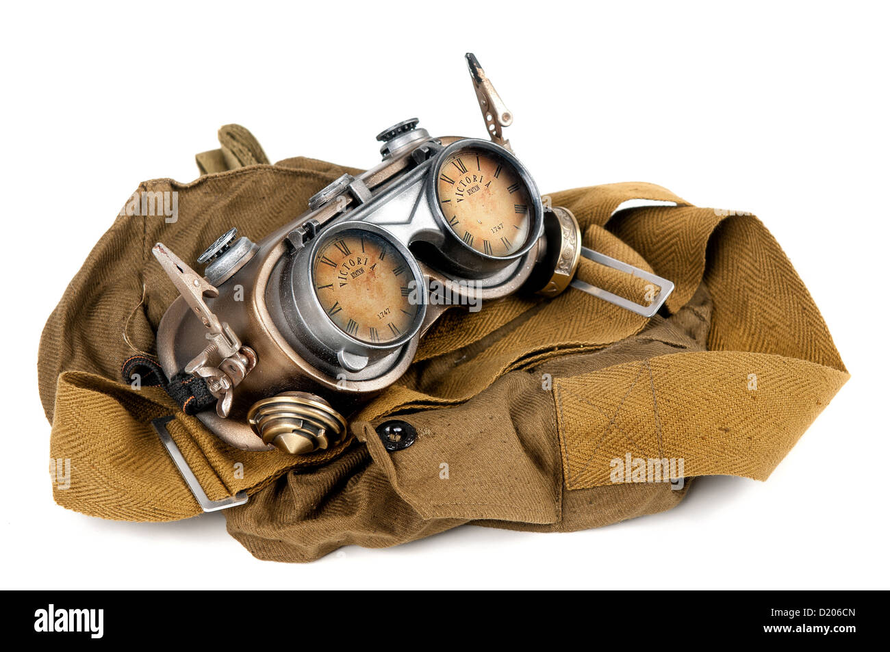 Steampunk goggles over a haversack isolated in white Stock Photo
